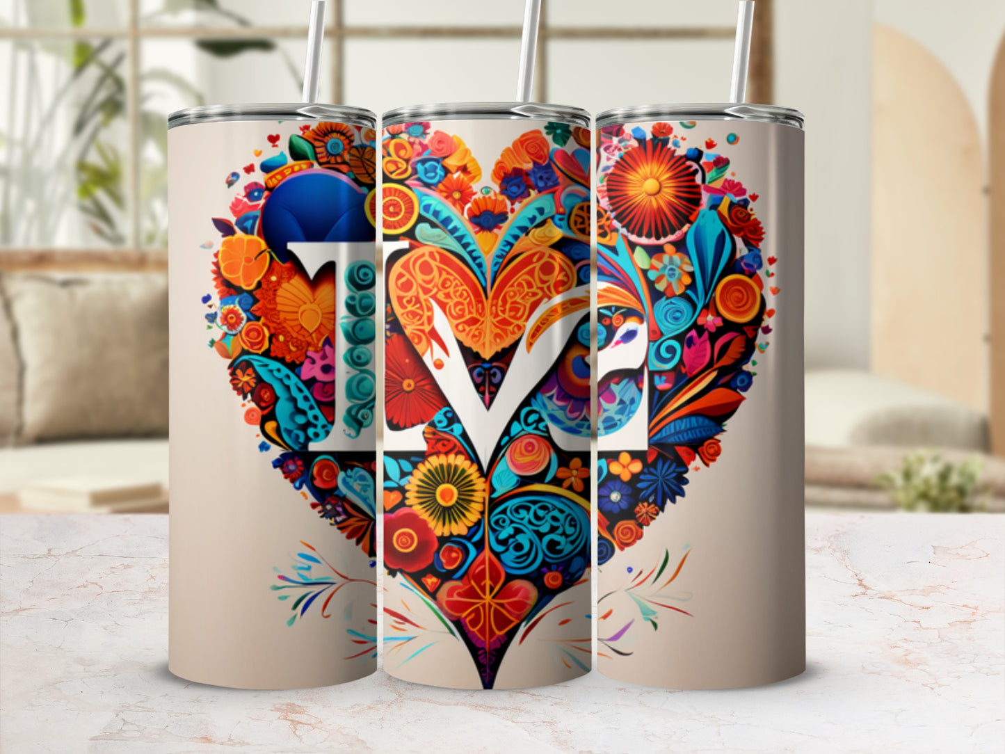 Heart-shaped floral design with "love" in white letters on a tan tumbler.