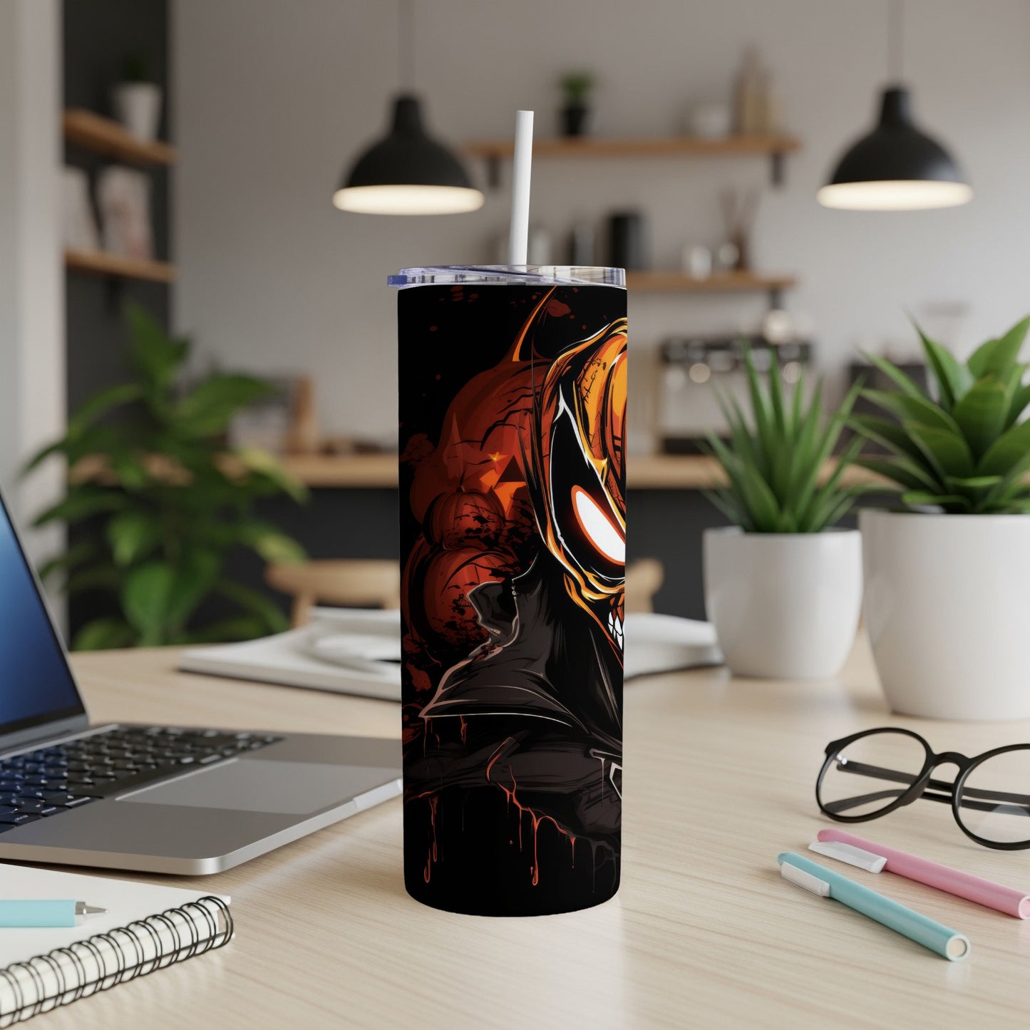 Black tumbler featuring a spooky, grinning jack-o'-lantern demon character.