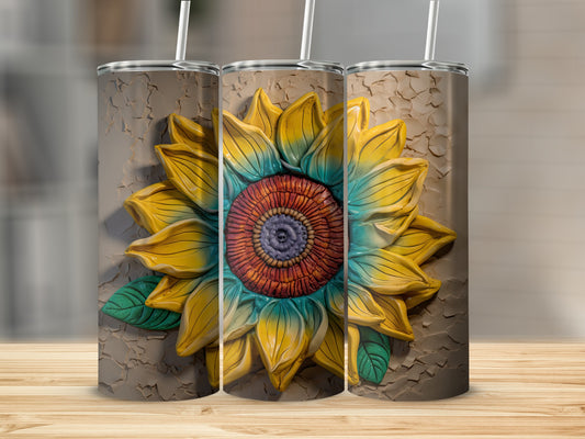 Three tumblers with a raised sunflower design, one in front, two slightly behind.