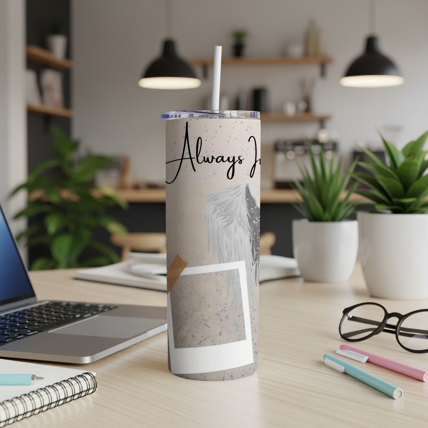 Tumbler with angel wings and text "Always Joy" against speckled background.