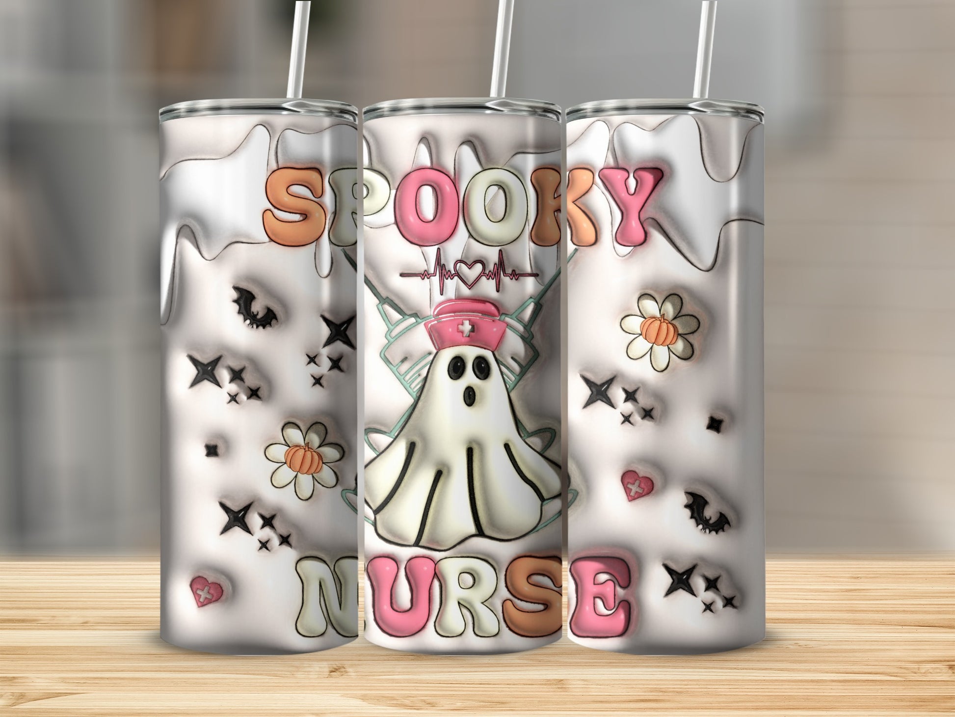 Spooky Nurse tumbler with ghost, bats, and flowers on a wooden surface.