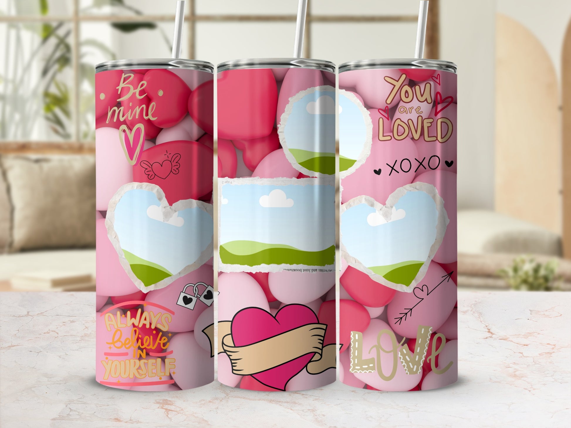 Three Valentine's themed tumblers with hearts and text "Be mine", "You are loved", and "Always believe in yourself".