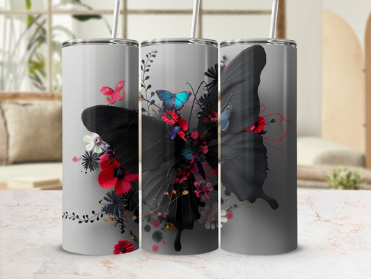 Dark butterfly with flowers and floral accents on a grey tumbler.