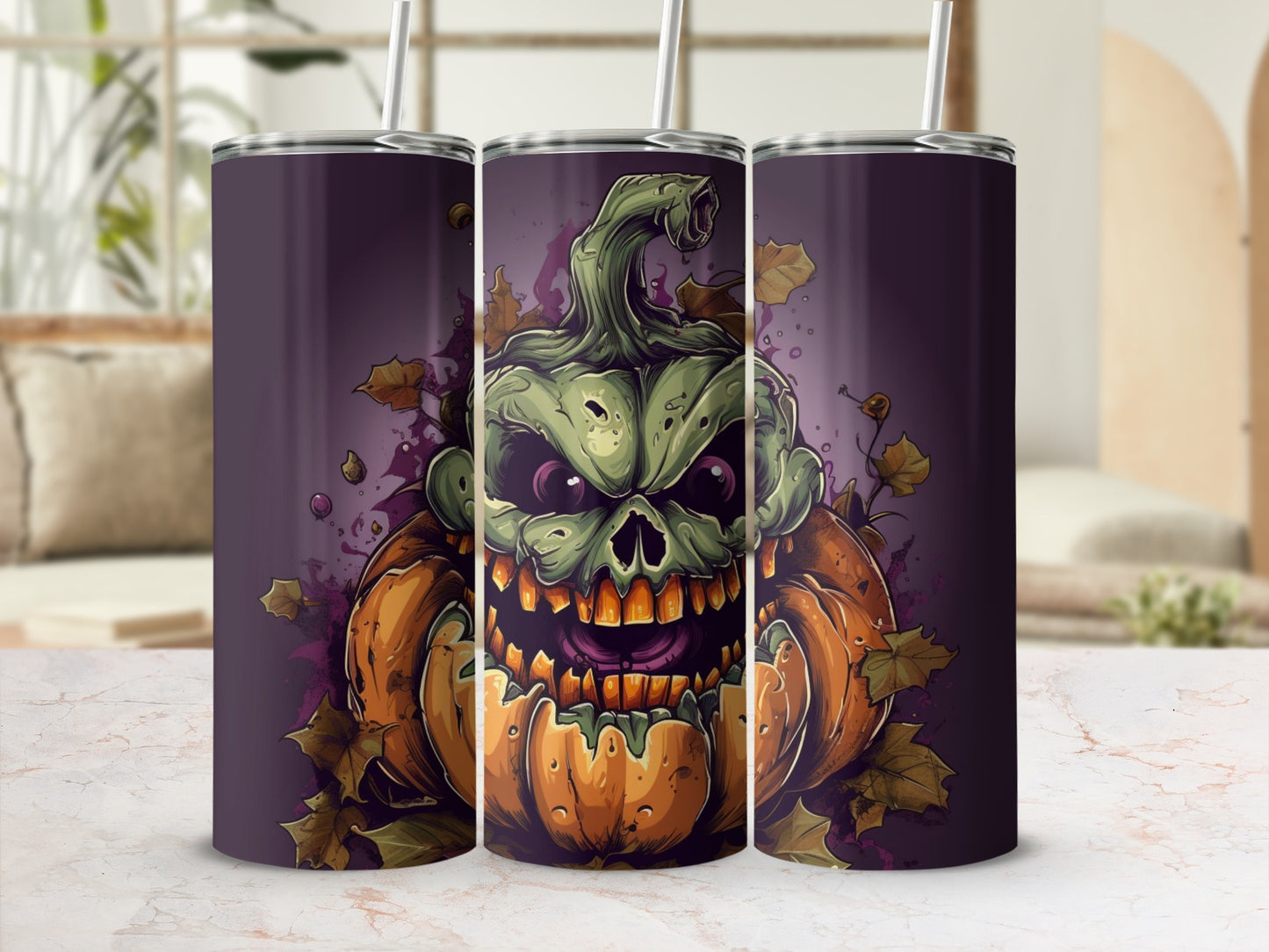 Three tumblers with a green, monstrous jack-o'-lantern design and falling leaves.