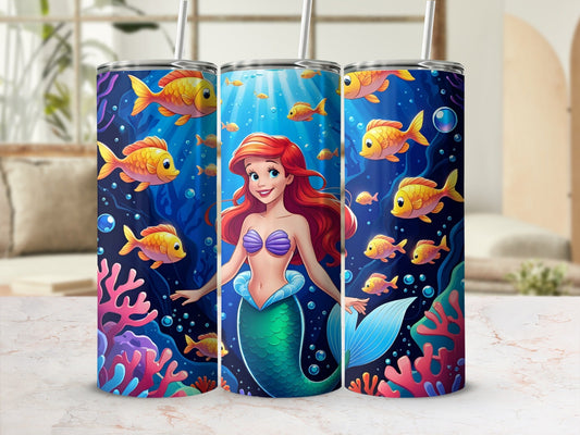 Mermaid surrounded by colorful fish and coral reefs.
