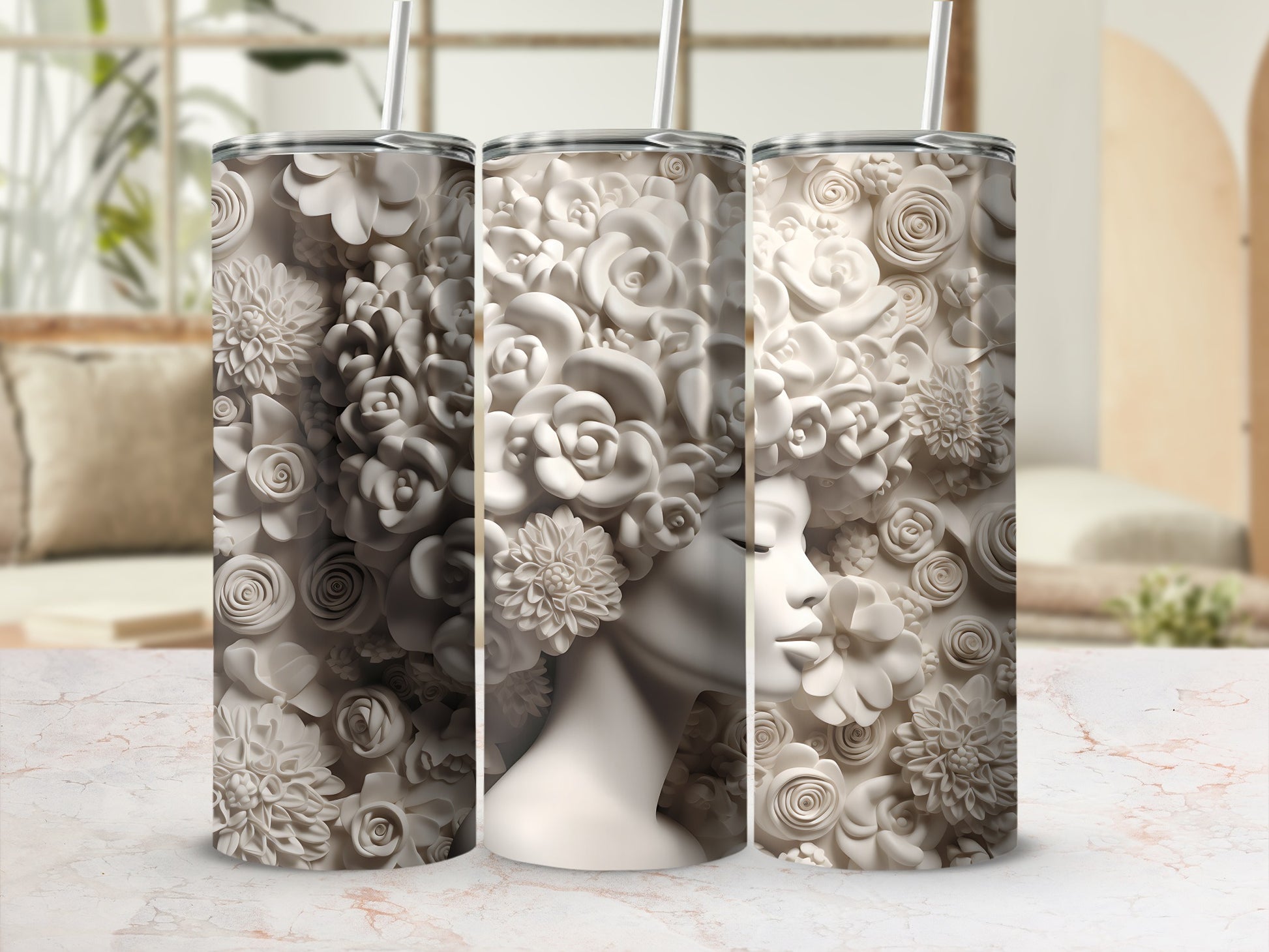 Three tumblers with a sculpted floral pattern resembling a woman's profile.