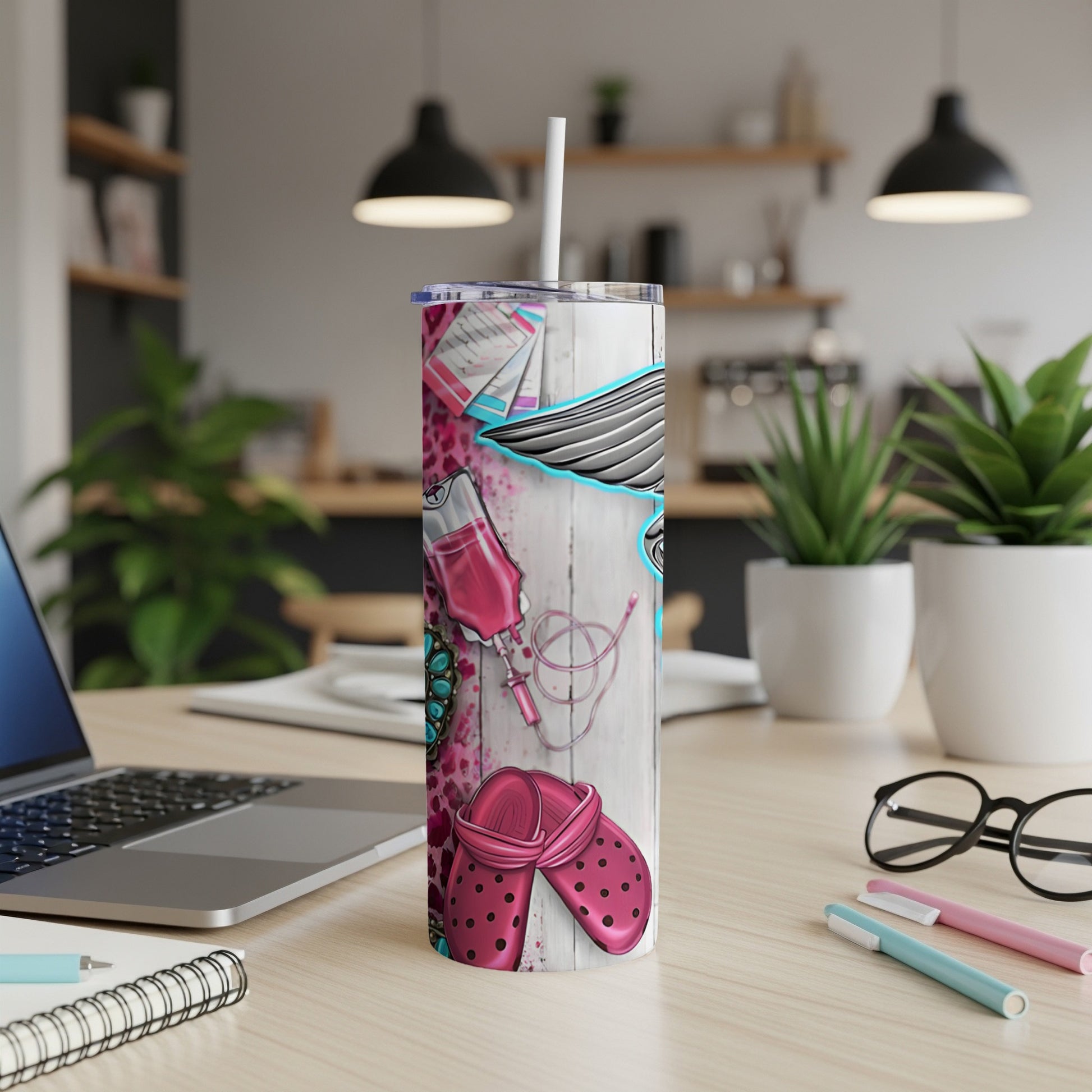 Pink medical print tumbler with medical tools, stethoscope, and crocs.