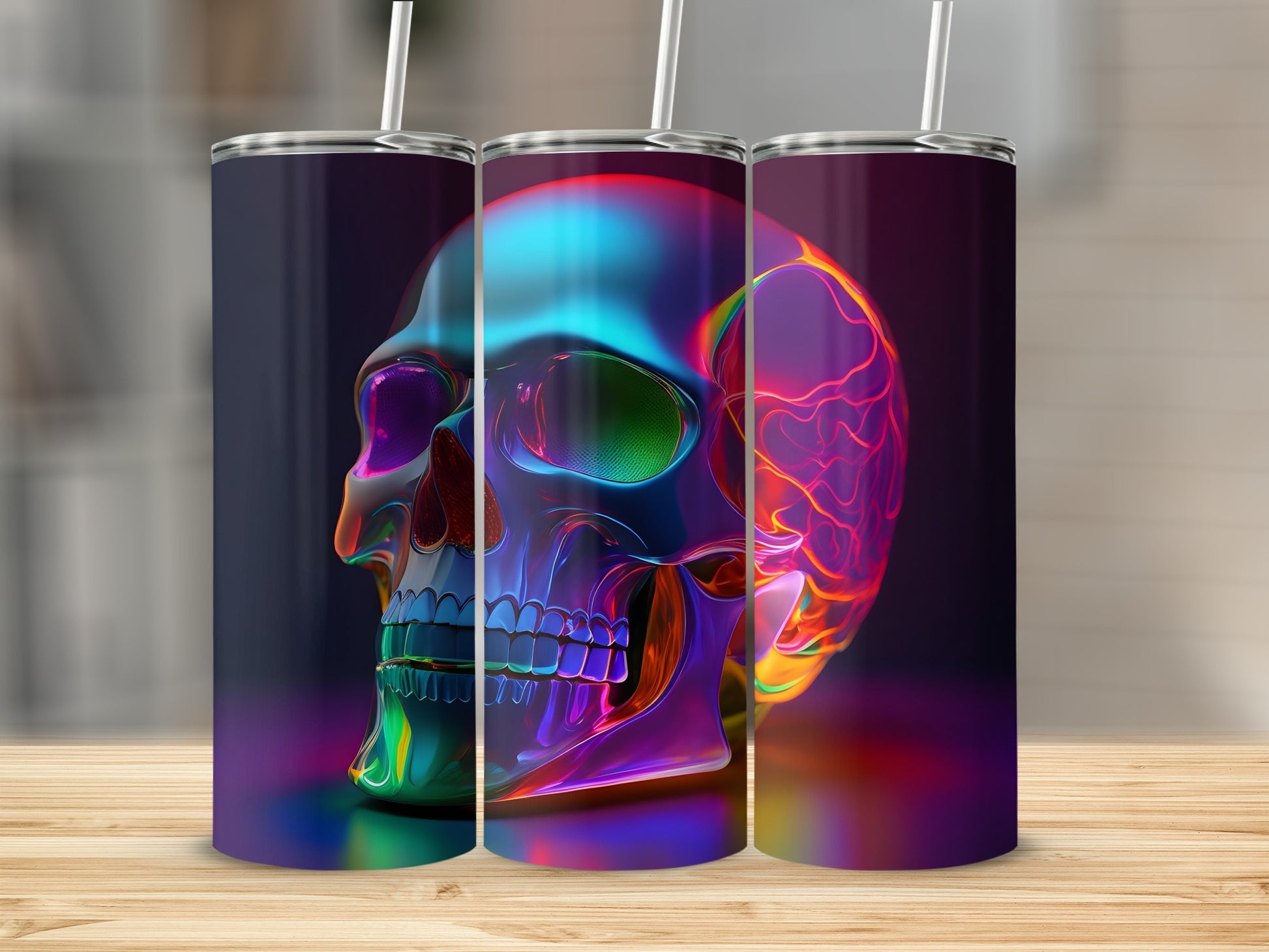 Three tumblers with iridescent skull designs sit on a wooden surface.