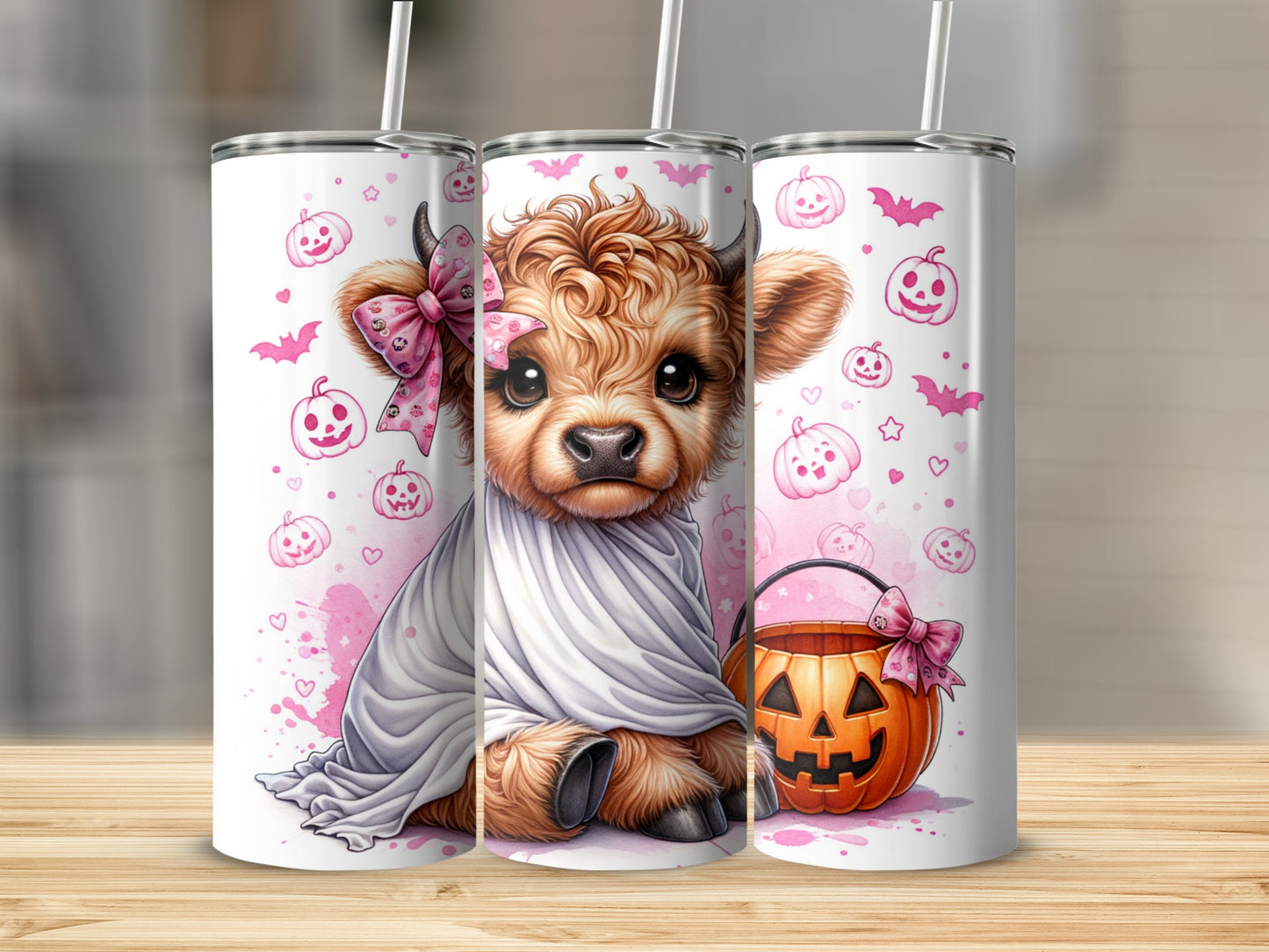 Cute cow ghost with Halloween pumpkins and bats on a skinny tumbler.