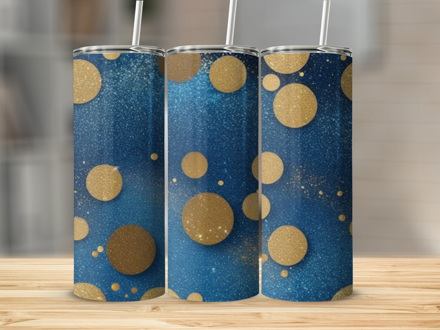 Three tumblers with a blue and gold glittery polka dot design.