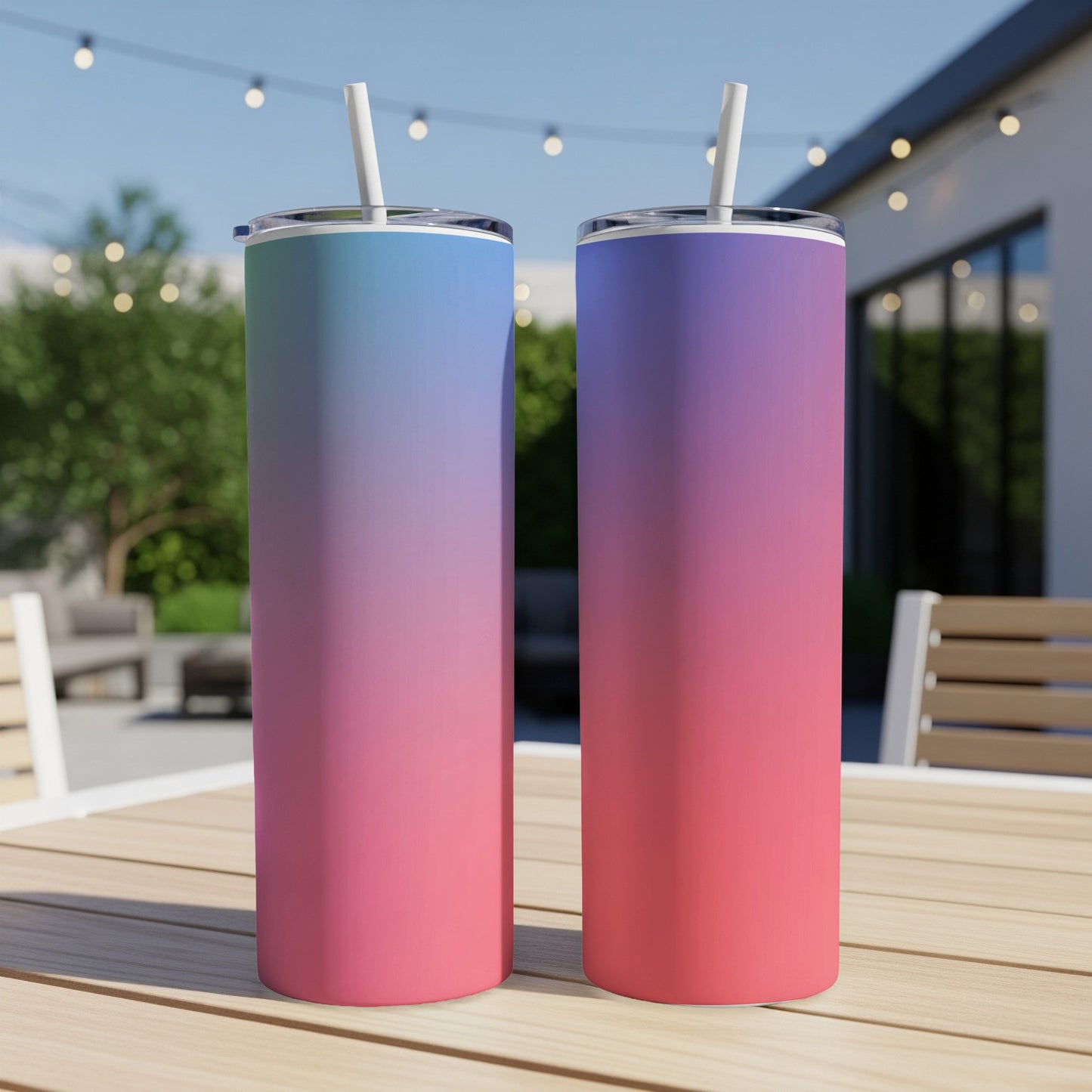 Two tumblers with blue, purple, and pink gradient colors on a wooden table.