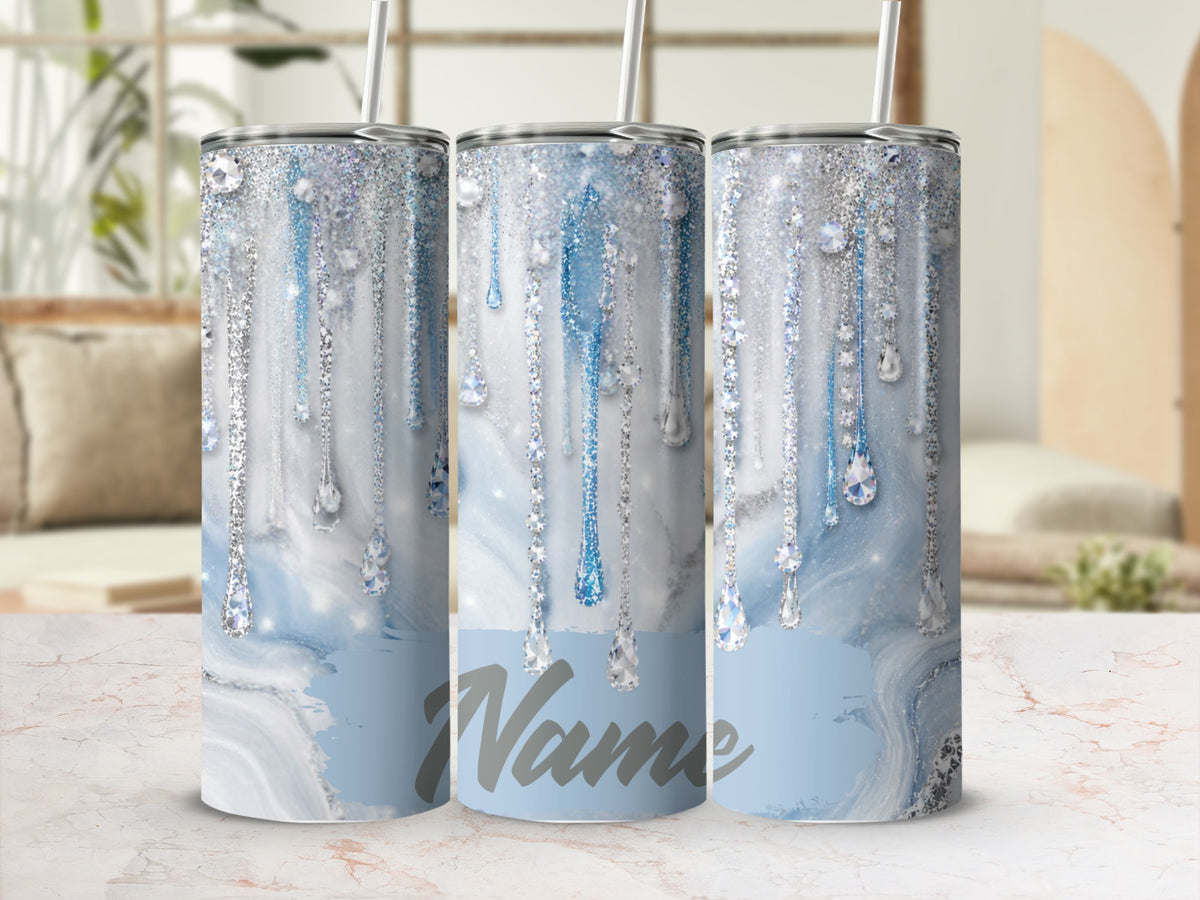 Three tumblers with blue marbled design and dripping diamond glitter accents.