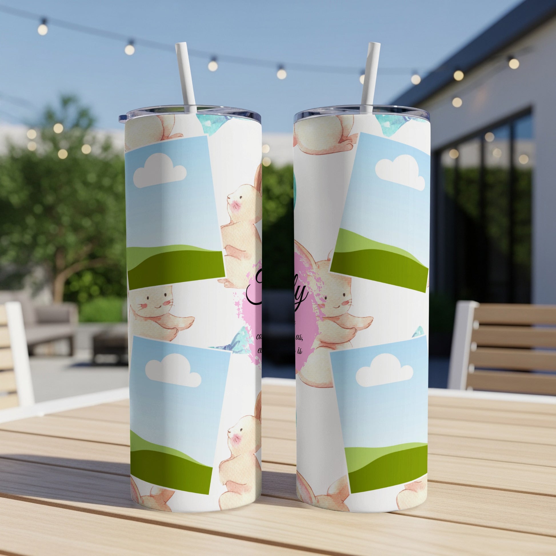 Two tumblers with pastel bunnies, clouds, and rolling green hills.