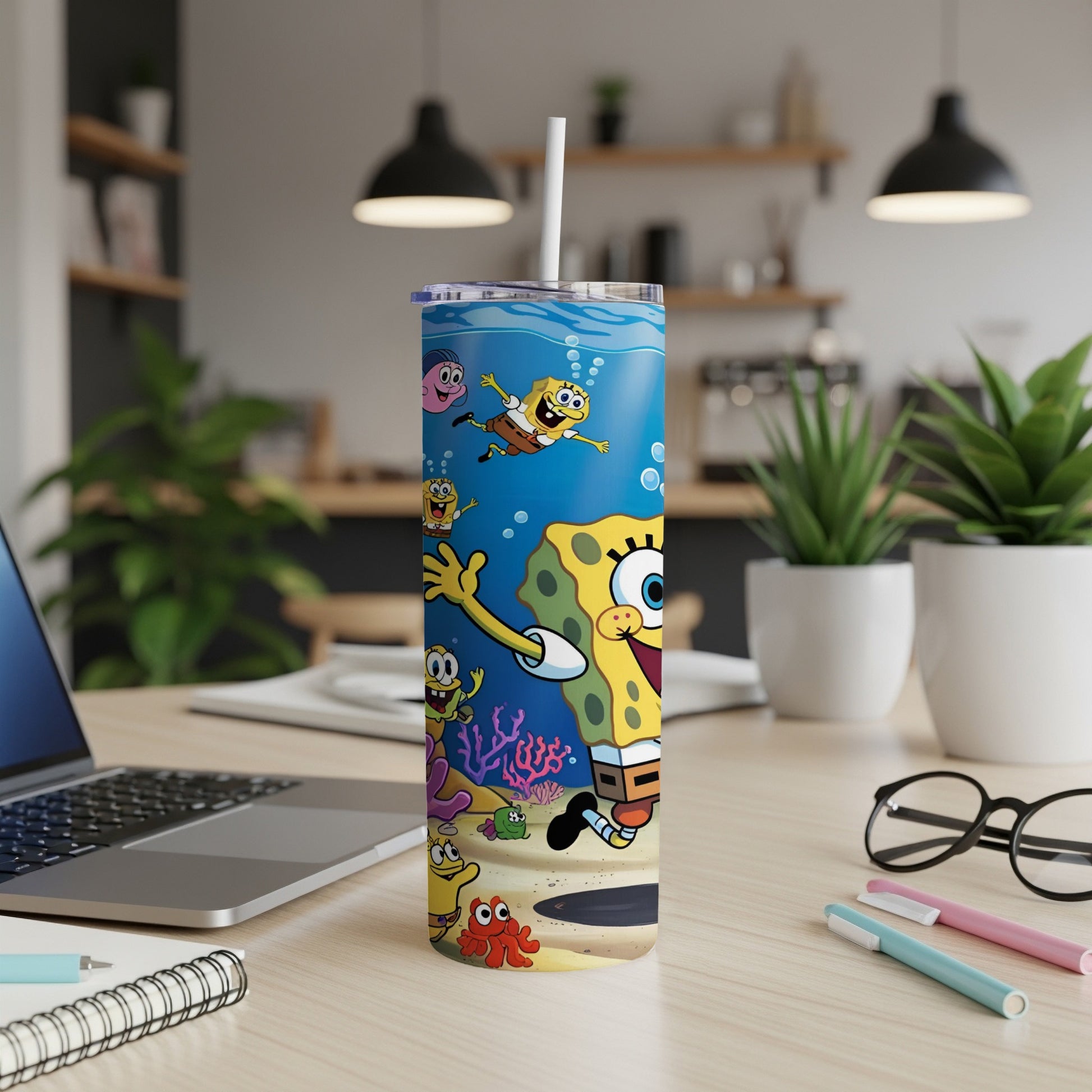 SpongeBob SquarePants tumbler with straw, featuring SpongeBob and friends underwater.