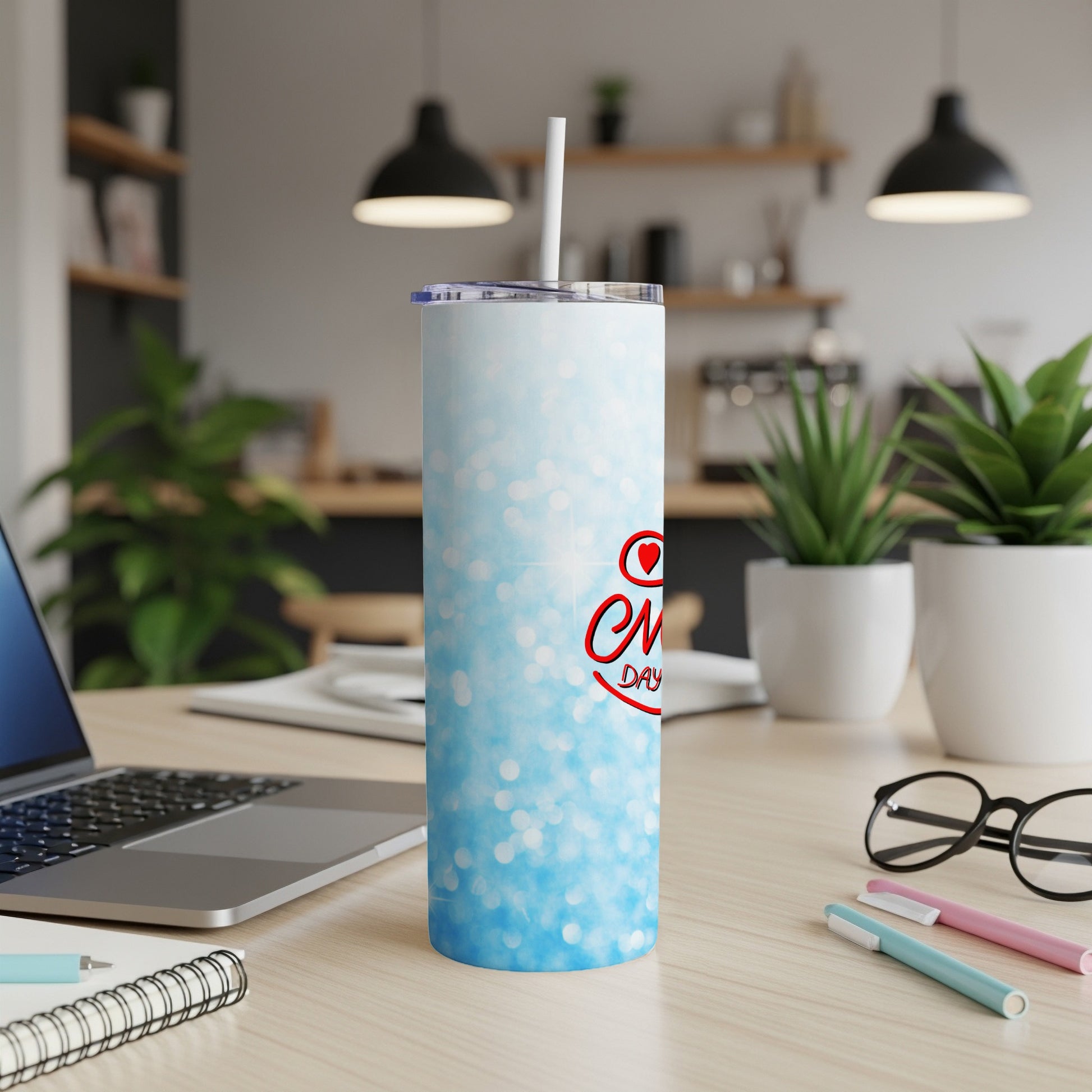 Blue glitter tumbler with "Every Day is a New Beginning" text and straw.