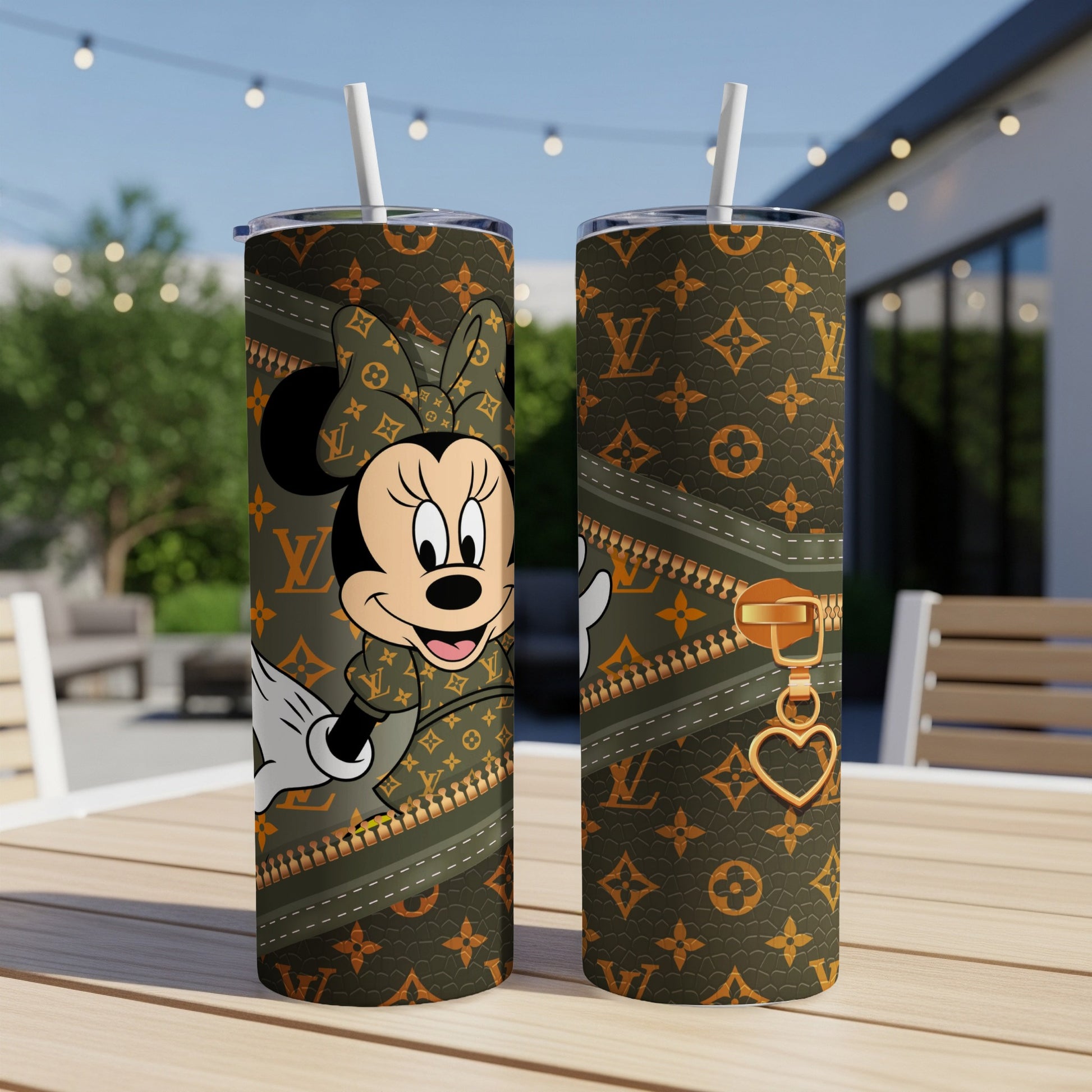 Minnie Mouse on a designer patterned tumbler with gold zipper detail.