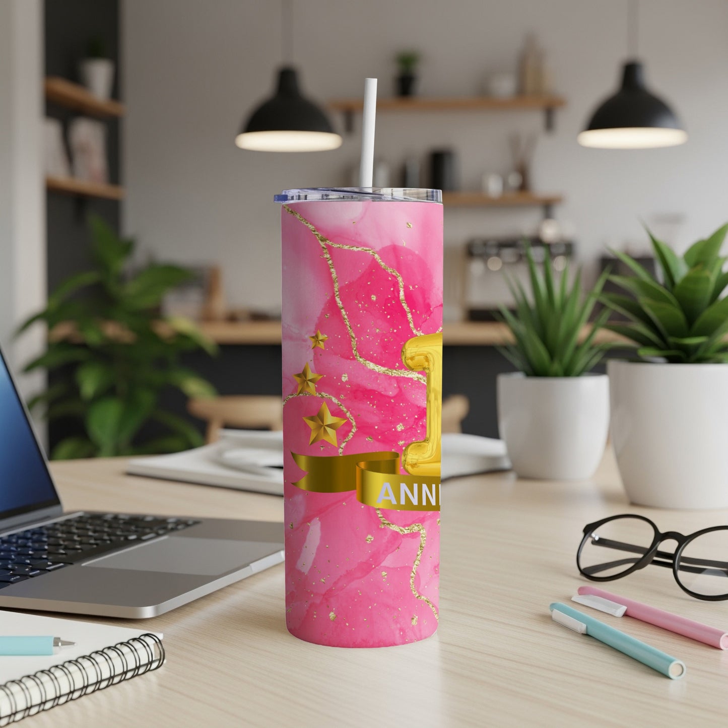 Pink marble tumbler with gold accents and "Happy Anniversary" ribbon.