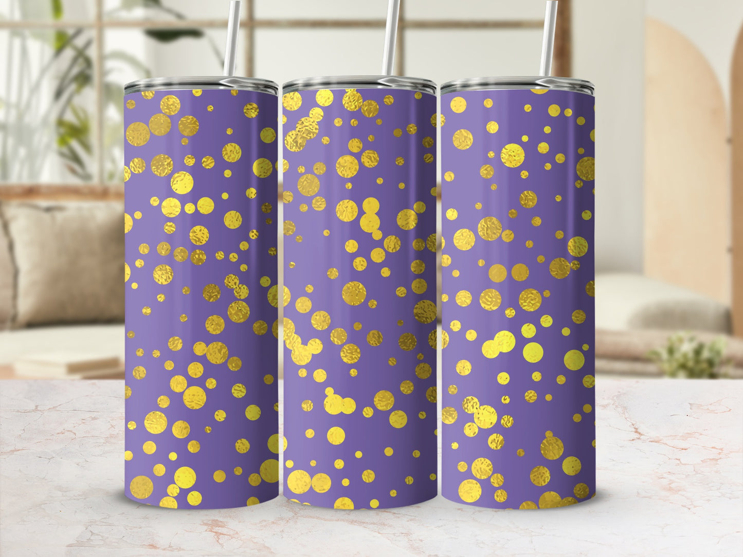 Three purple tumblers with a gold dot pattern and white straws.