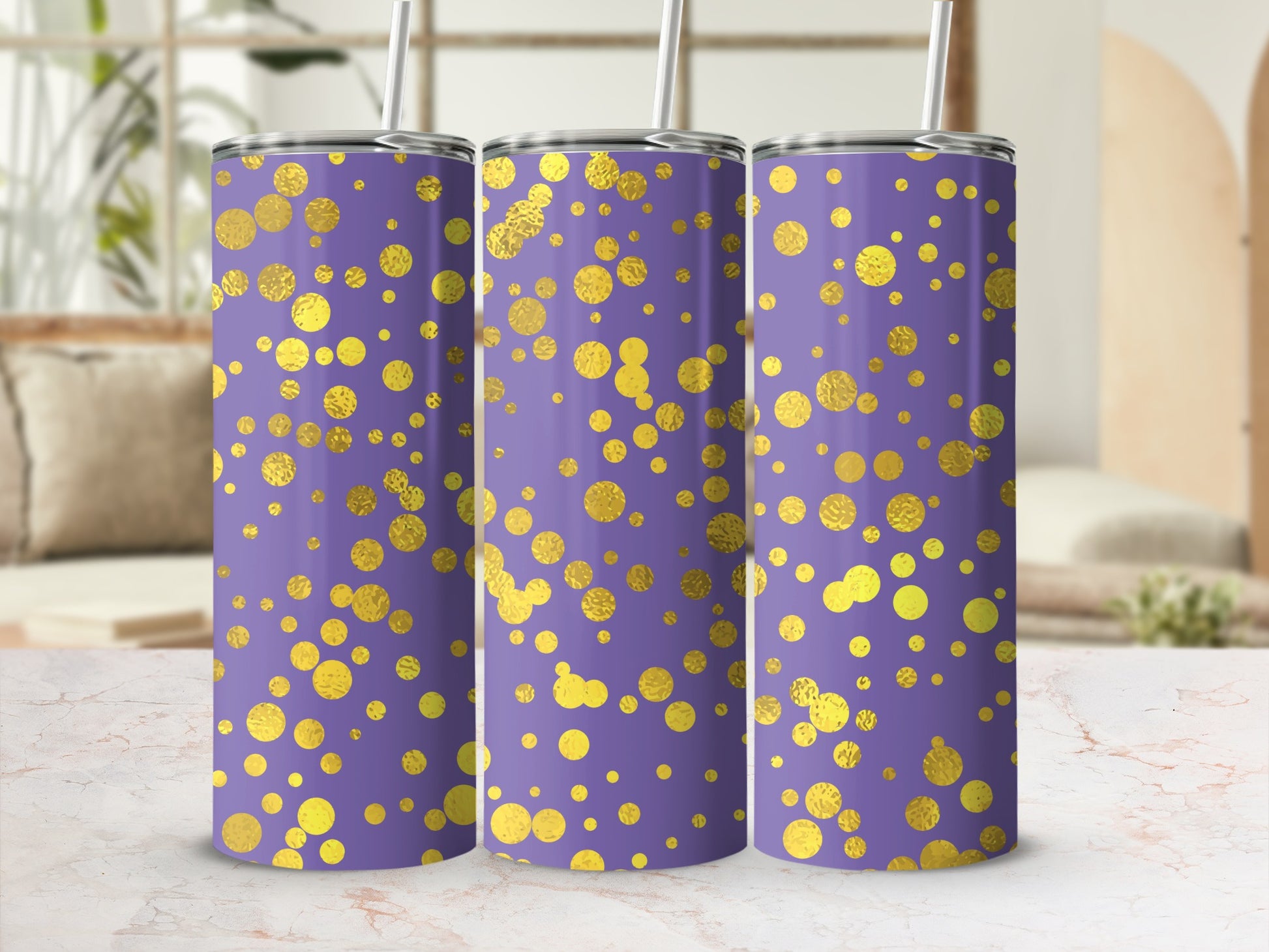 Three purple tumblers with a gold dot pattern and white straws.