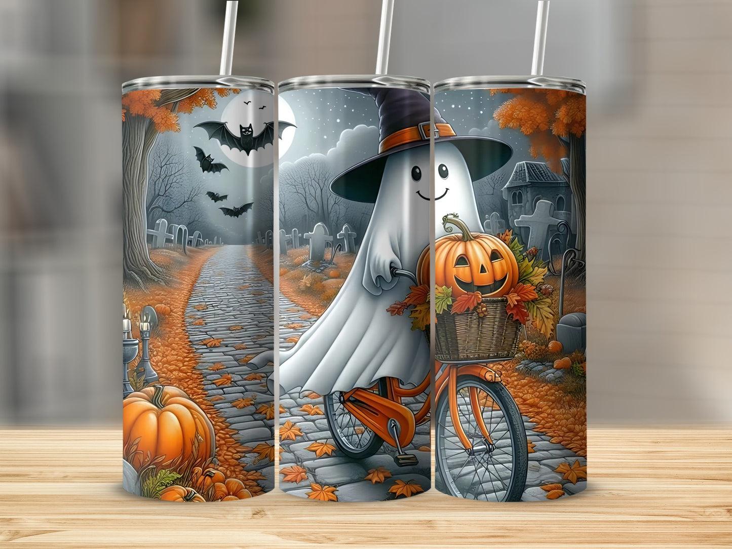 Halloween tumbler with ghost on bicycle carrying pumpkins and basket of leaves.