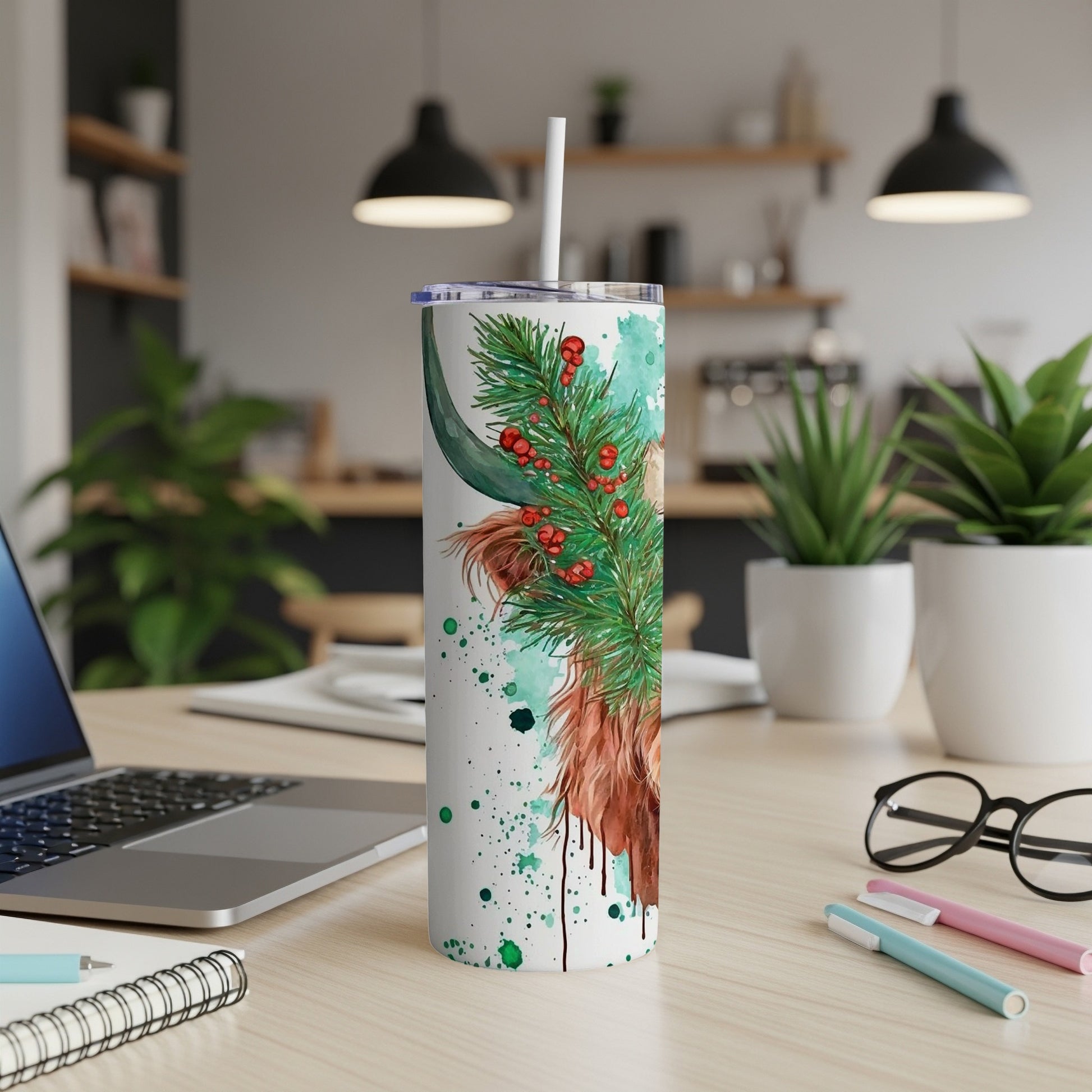 White tumbler with Highland cow and pine needles design.