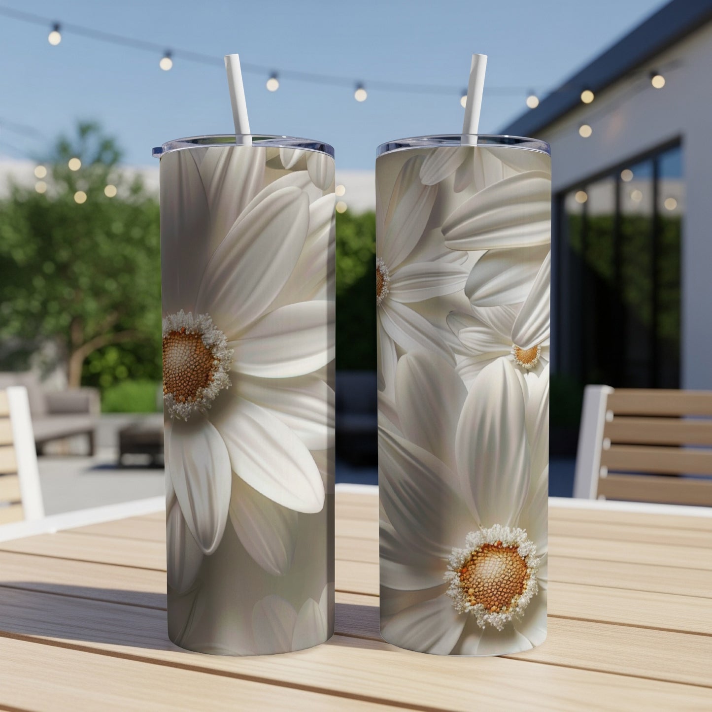 Two tumblers with close-up white daisy floral designs.