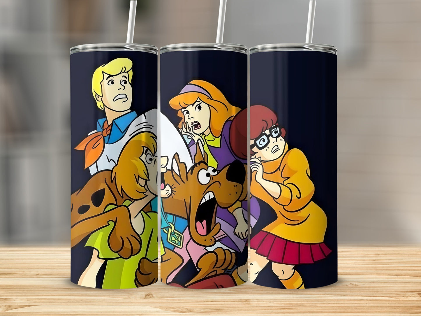 Scooby-Doo characters Fred, Daphne, Velma, and Scooby-Doo on a dark tumbler.