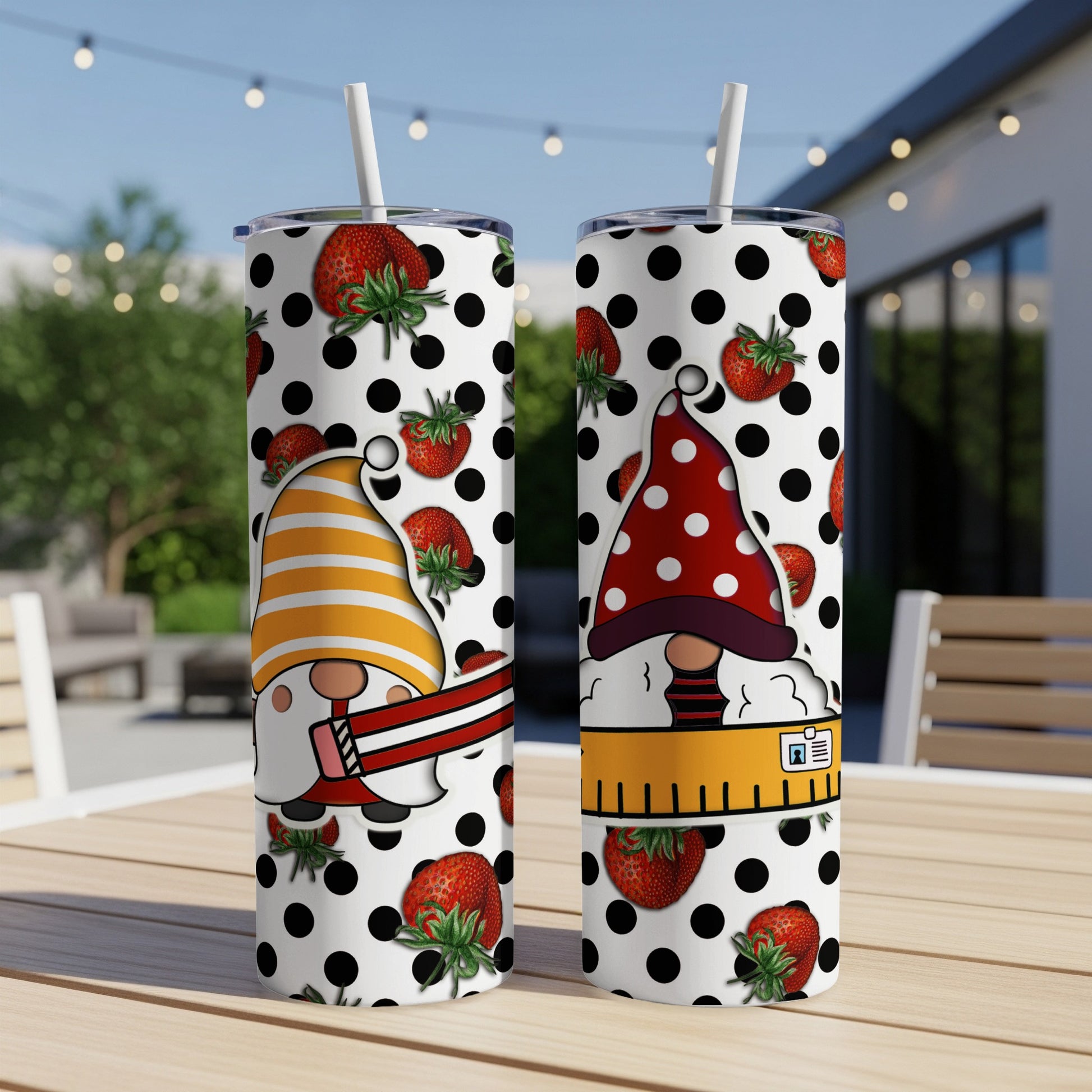 Two tumblers with gnomes, strawberries, and polka dots.
