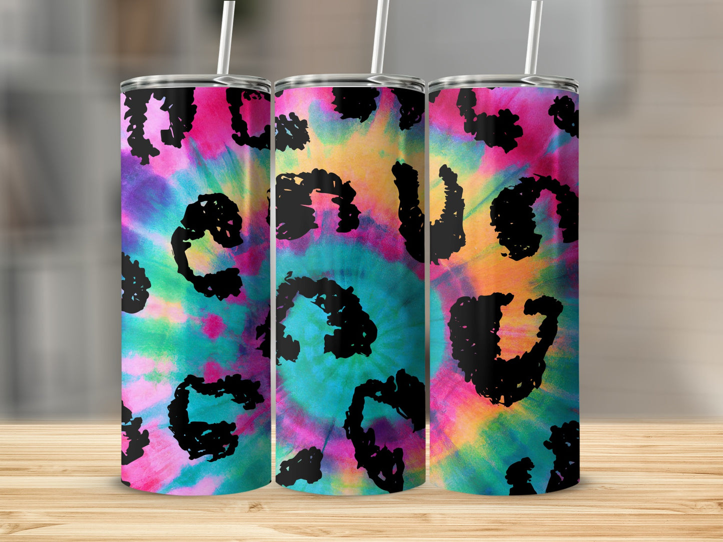Three tumblers with a colorful tie-dye pattern and black leopard print accents.