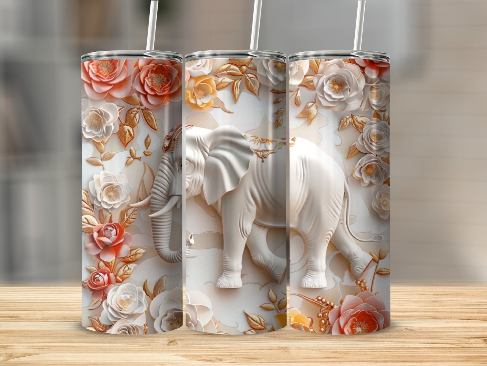 White embossed elephant with floral accents on a tumbler.