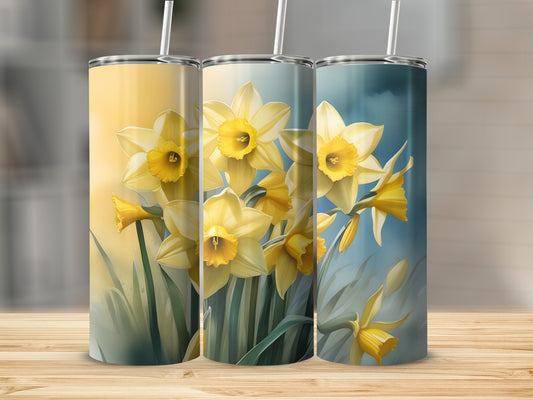 Three tumblers featuring yellow daffodils against a blurred watercolor background.