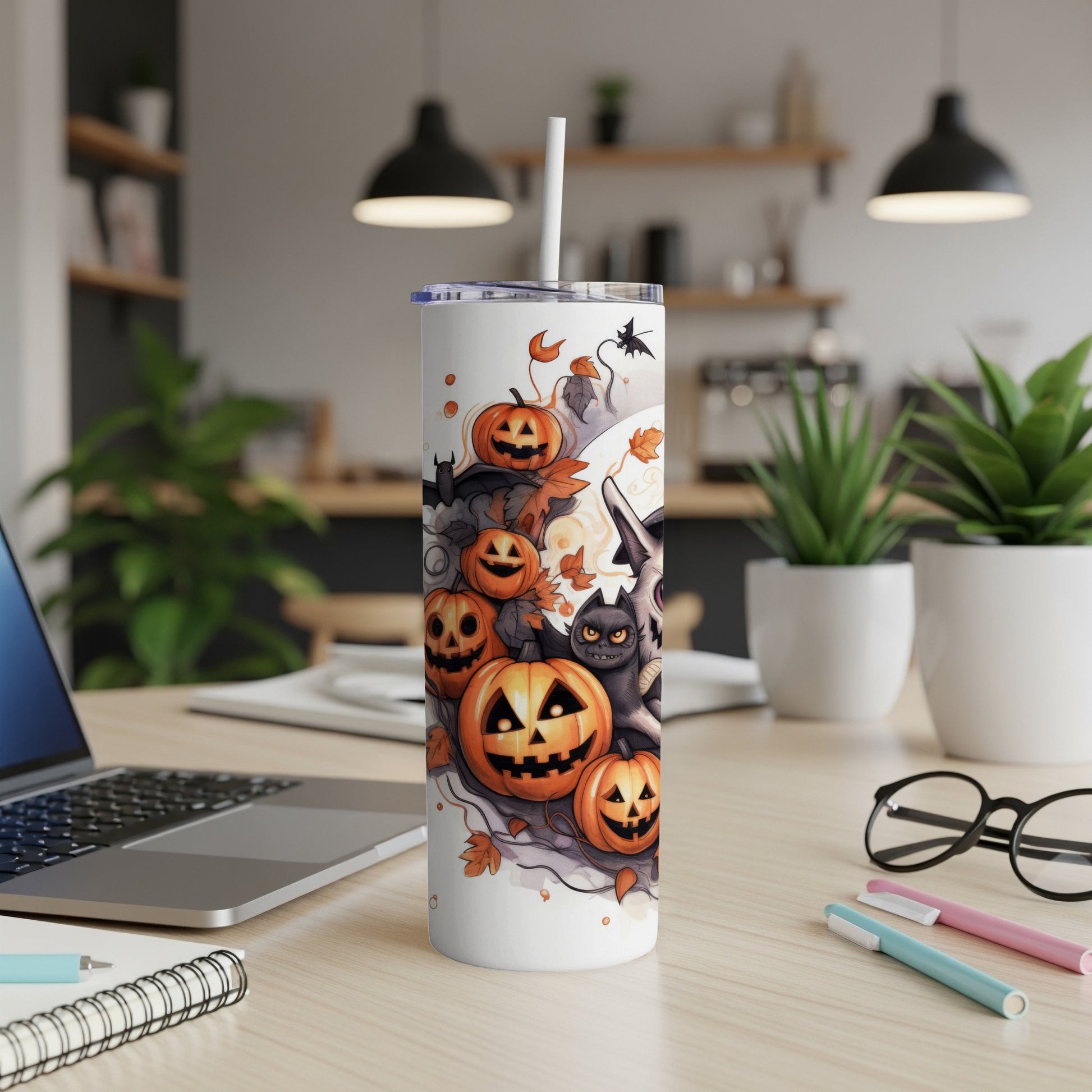 White tumbler with Halloween pumpkins, bats, cat, and witch hat design.