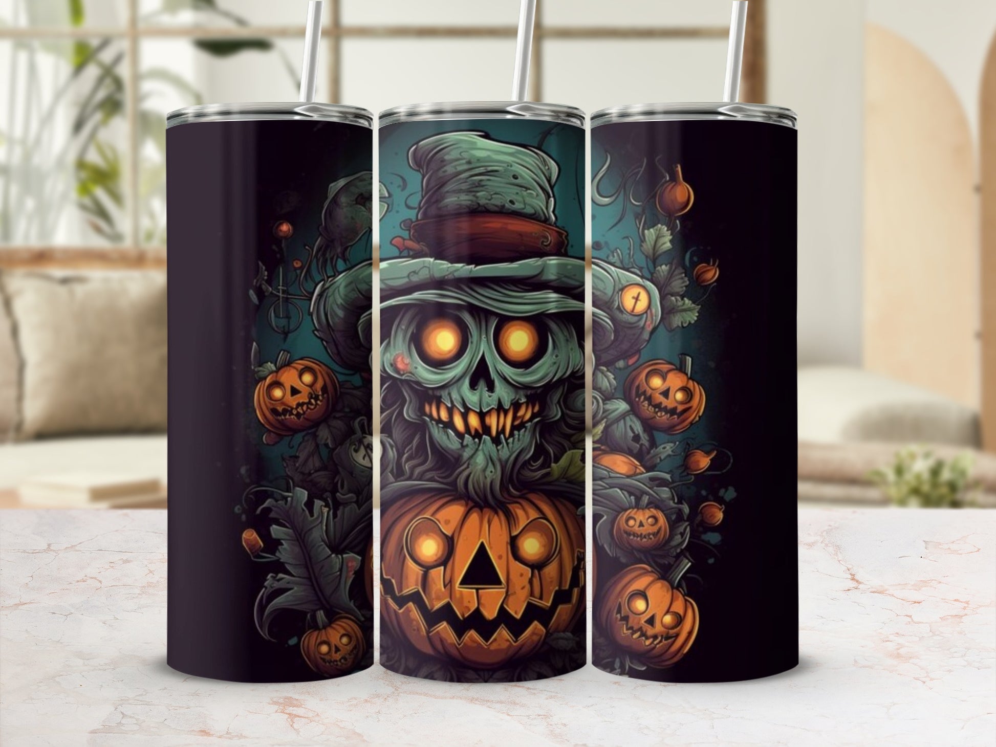 Three tumblers with a spooky Halloween design featuring a grinning skeleton and jack-o'-lanterns.