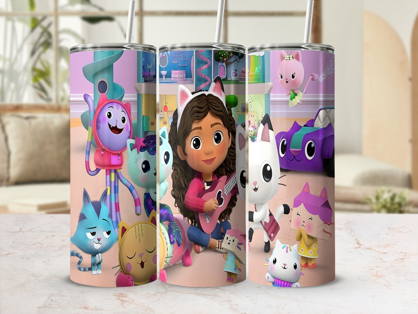 Gabby's Dollhouse characters on a pink tumbler with straw.