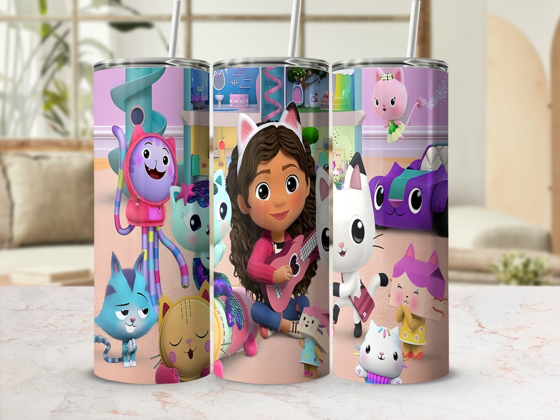 Gabby's Dollhouse characters on a pink tumbler with straw.