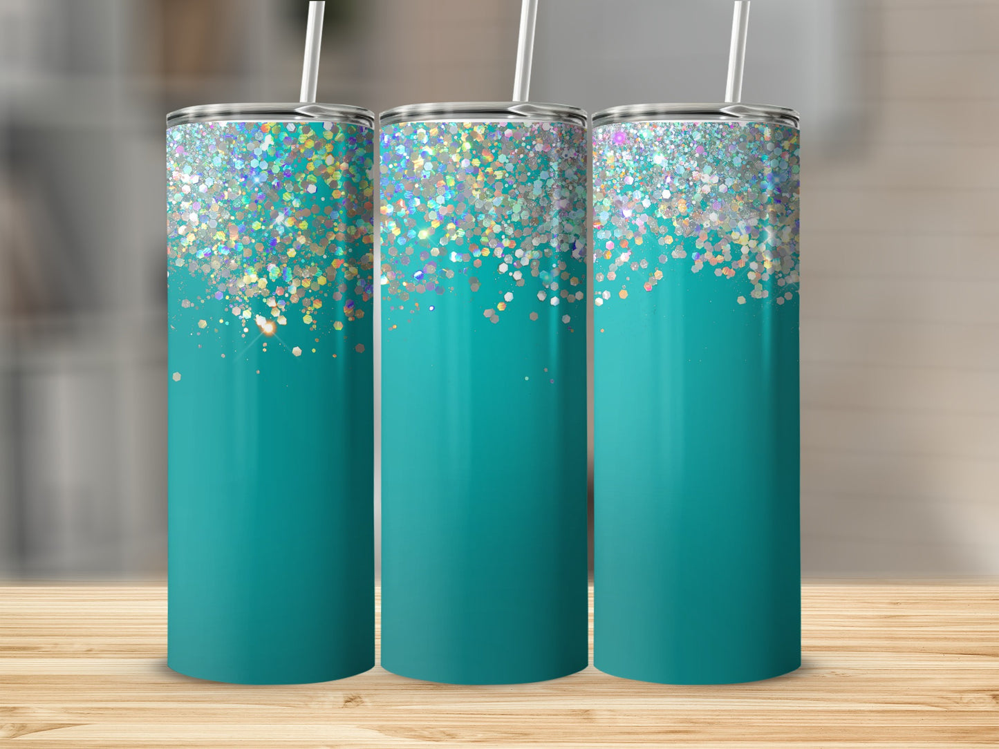Three teal tumblers with iridescent glitter ombre tops and white straws.