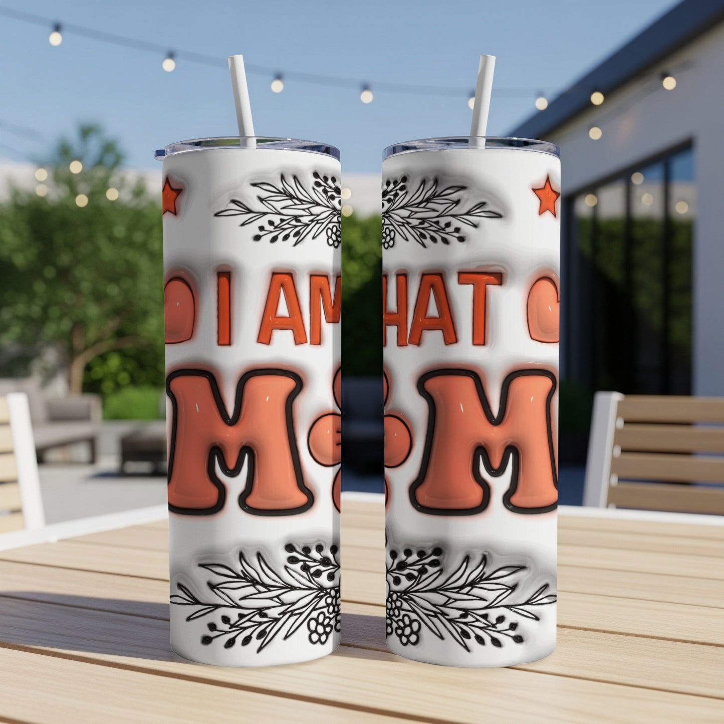 Two tumblers with "I AM WHAT I MmM" text and floral designs.