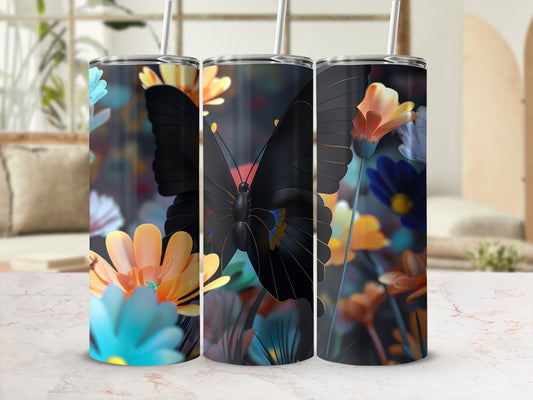 Three tumblers with black butterfly and floral designs on blurred background.