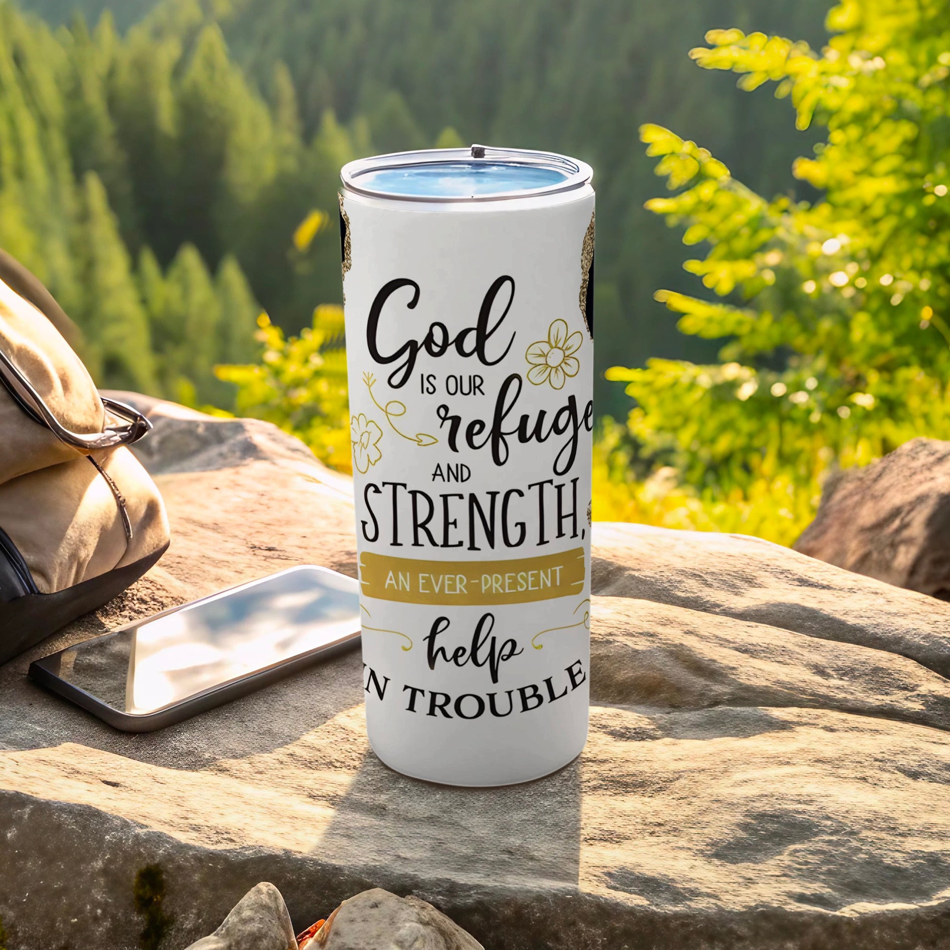 White tumbler with "God is our refuge and strength" text.