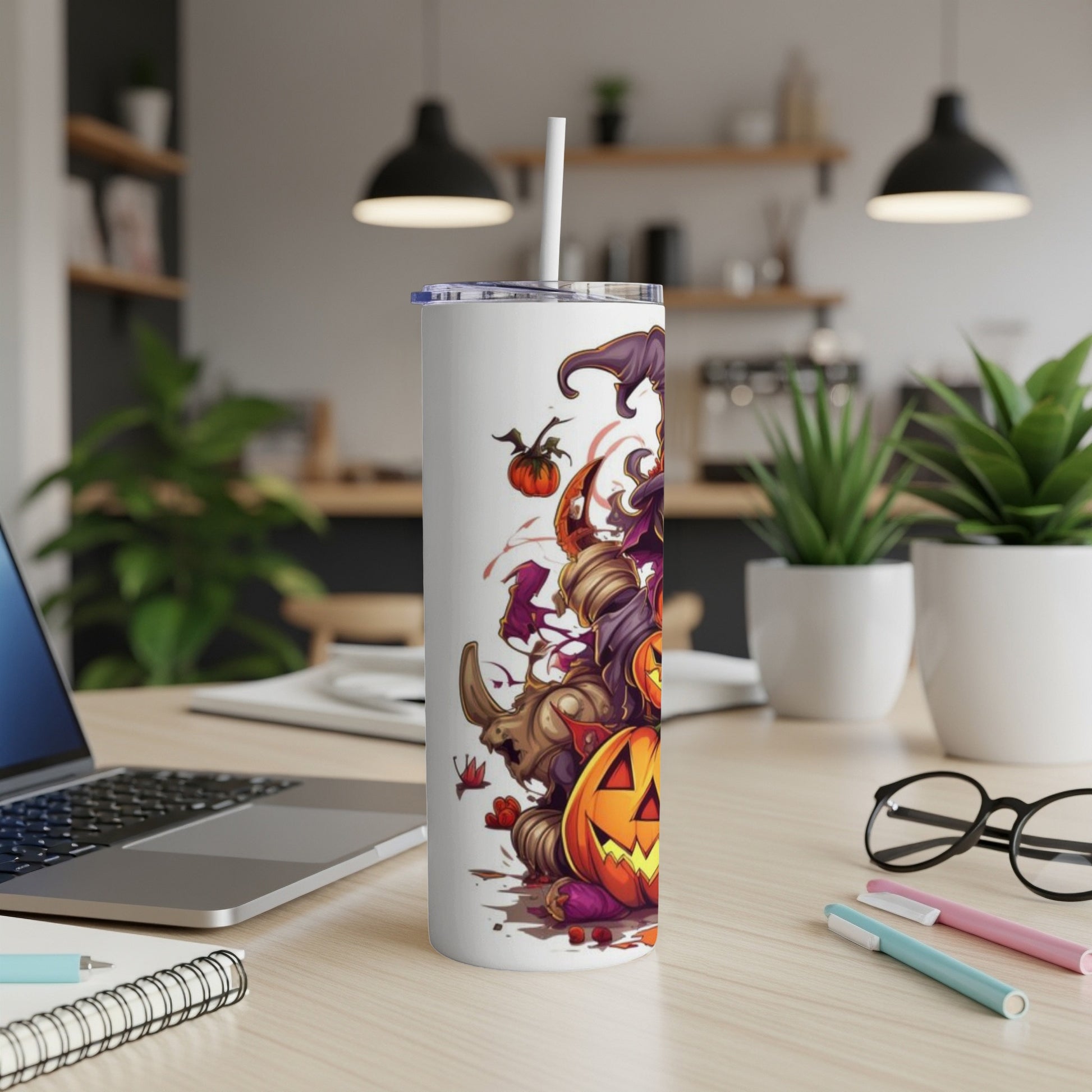 White tumbler with Halloween cartoon design featuring pumpkins and a rhino.