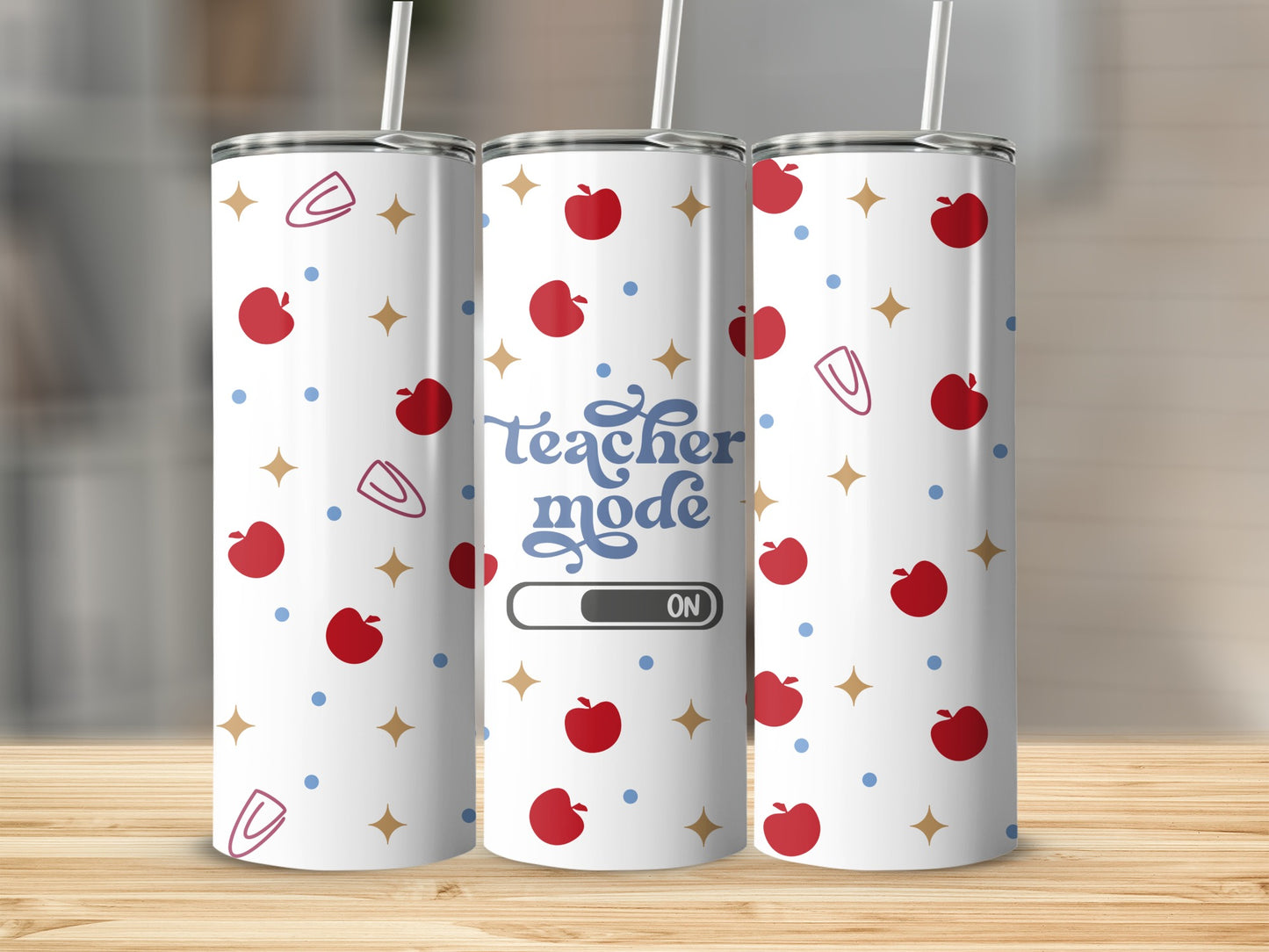 Teacher mode on tumbler with apples and paper clips pattern.