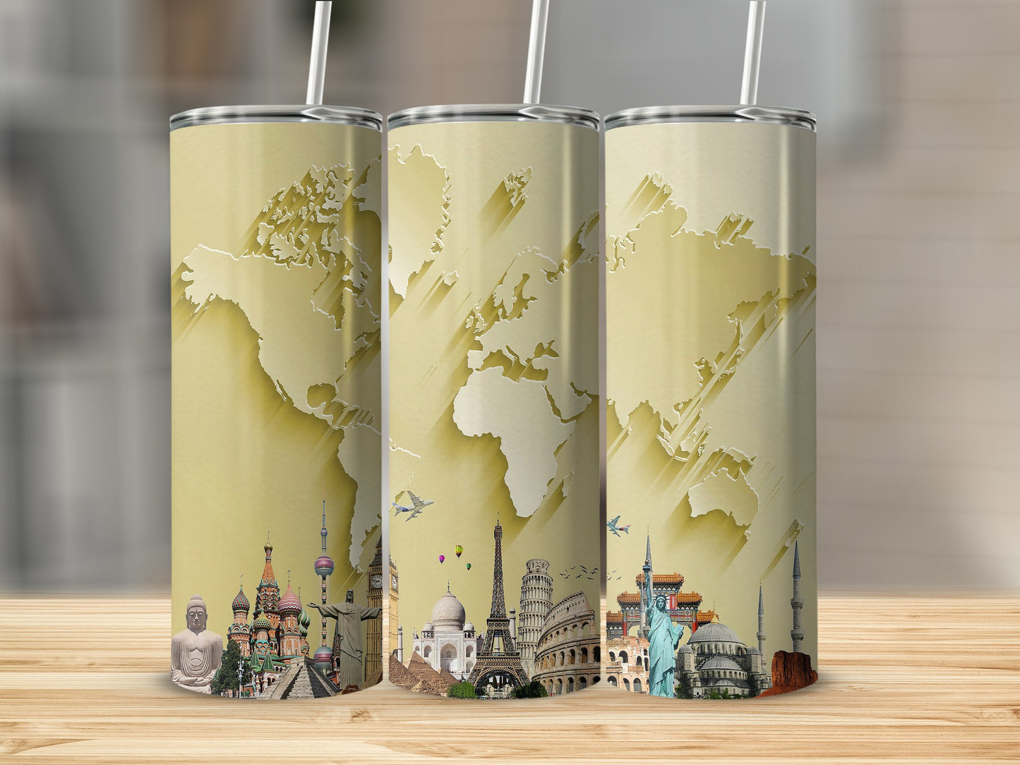 Three tumblers featuring a gold world map and iconic landmarks collage design.