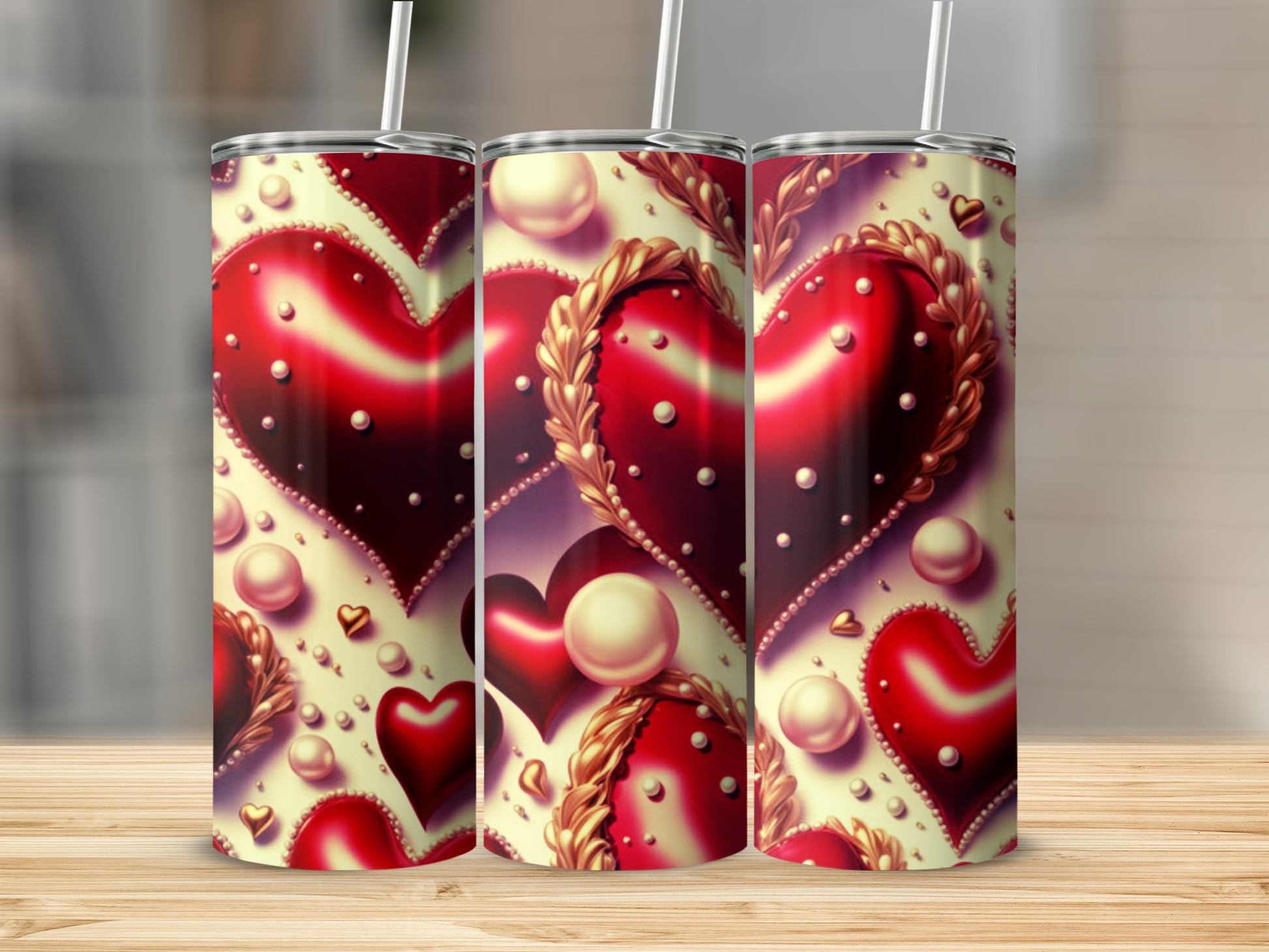 Three tumblers with a repeating heart and pearl pattern.