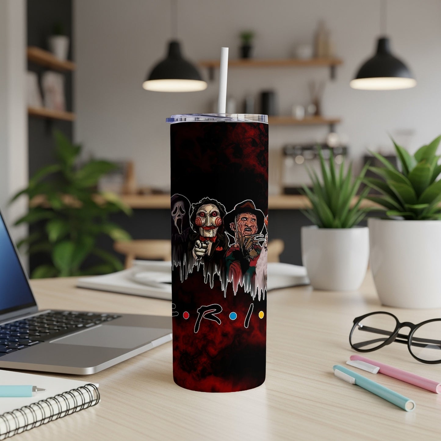 Tumbler with horror characters and Friends logo on a red smoky background.