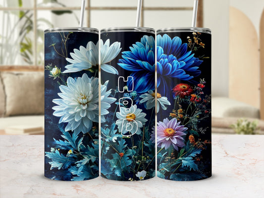 Three tall tumblers featuring a dark floral design with the letters "HBD" overlaid.