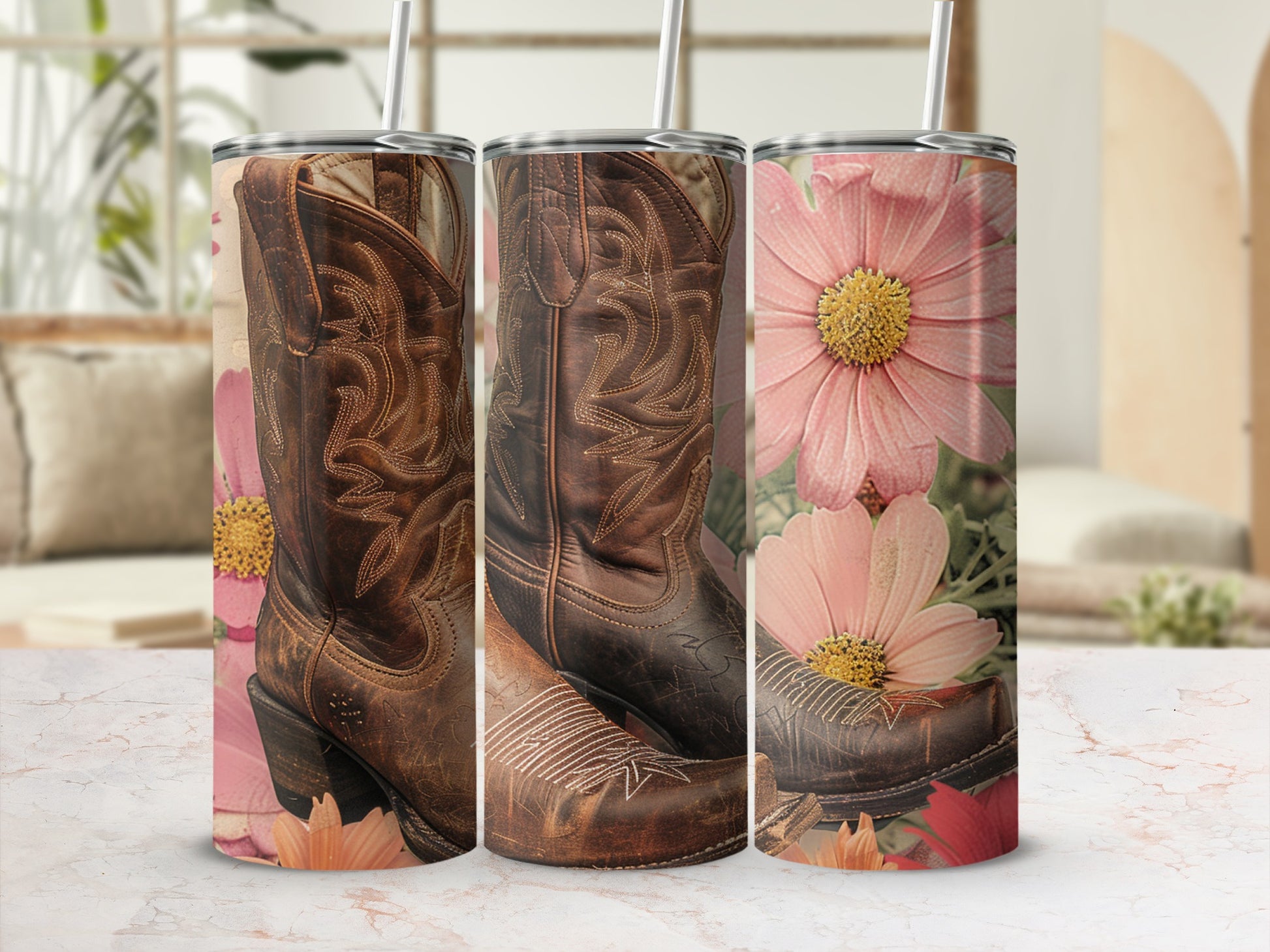 Cowboy boots and pink flowers on a tumbler, with a blurred background.