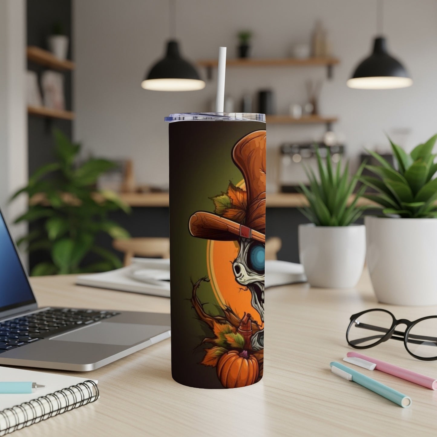 Halloween tumbler with skull, pumpkin, leaves, and top hat design.