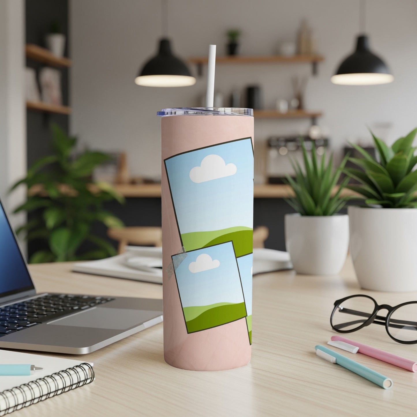 Pink tumbler with stacked landscape photos and white straw.