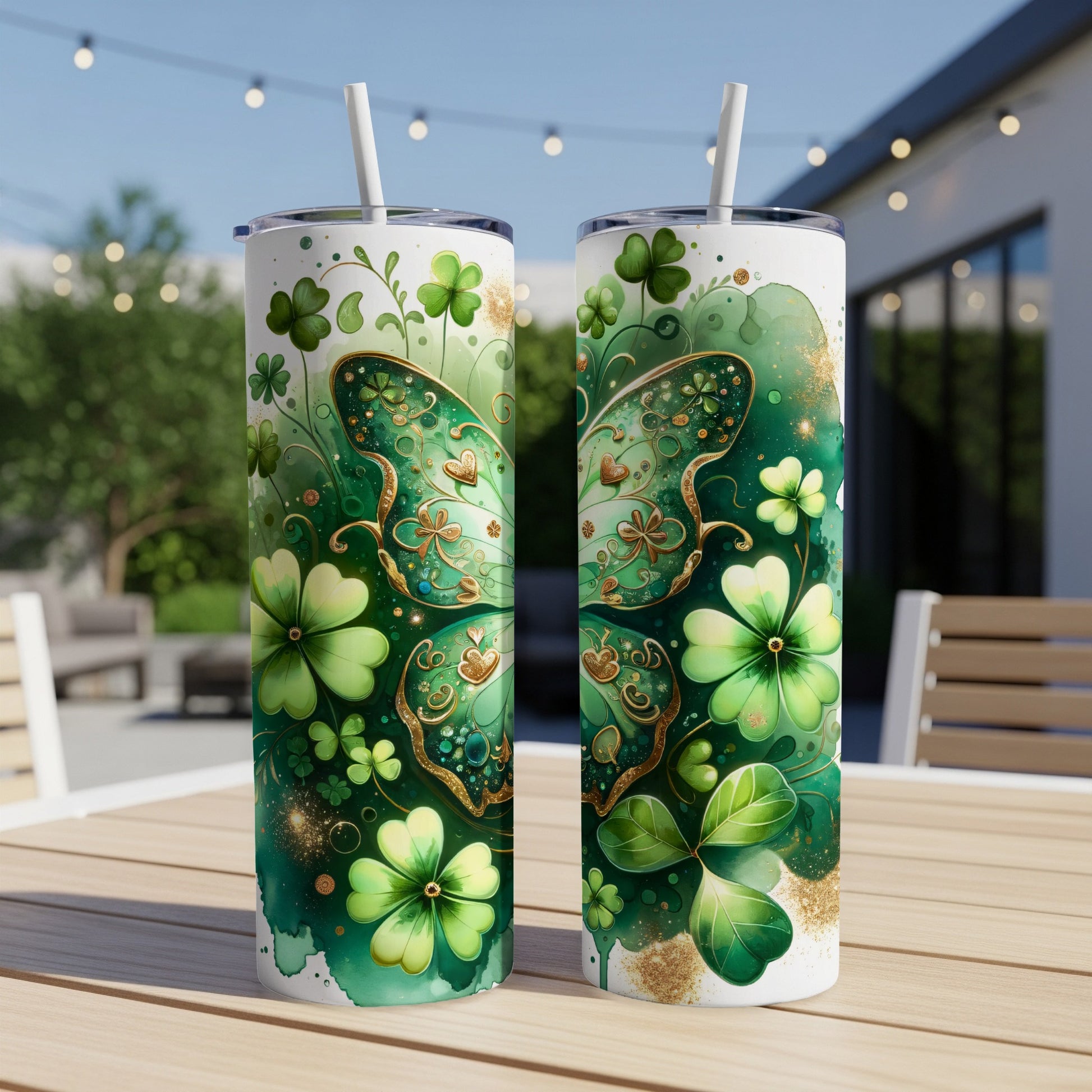 Two St. Patrick's Day tumblers with shamrocks and a butterfly design.