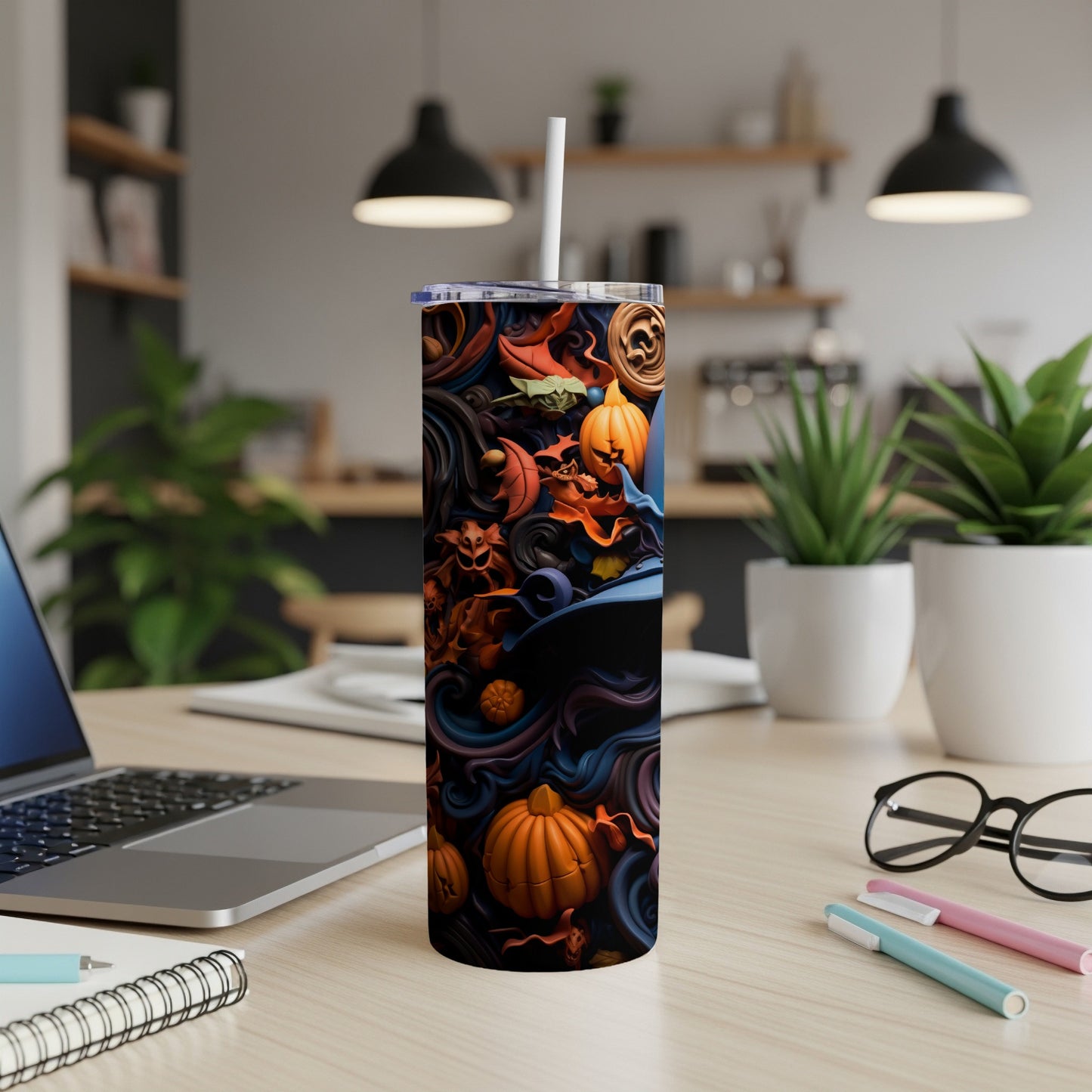 Tumbler with Halloween pattern of pumpkins, bats, and witch hat.